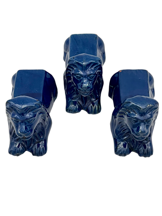 VINTAGE TRIO OF GLAZED PETROLEUM BLUE TERRA COTTA LIONS