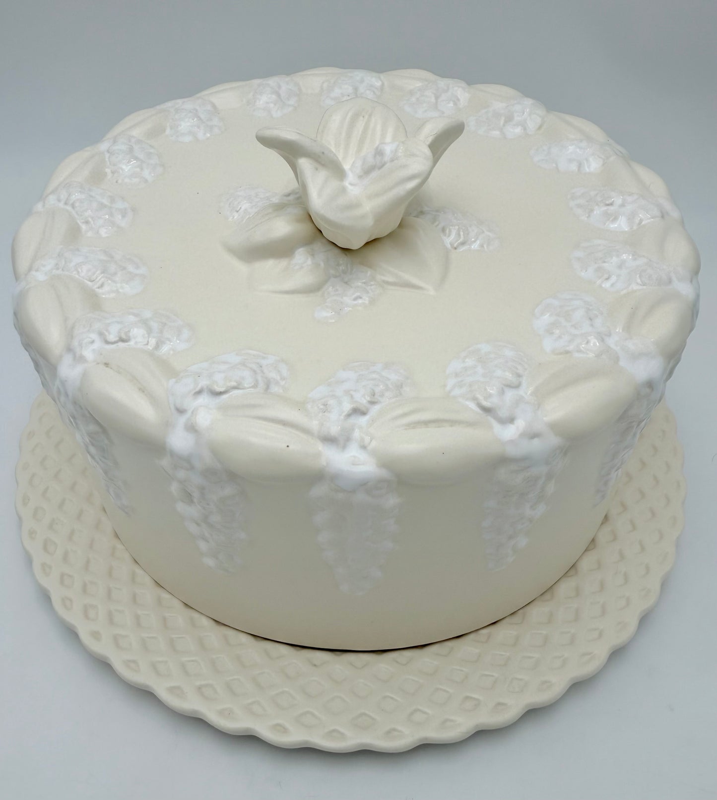 VINTAGE PORTUGUESE EARTHENWARE COVERED DOME WITH MATCHING PLATE – CREAM & WHITE FLORAL RELIEF – 12.5”
