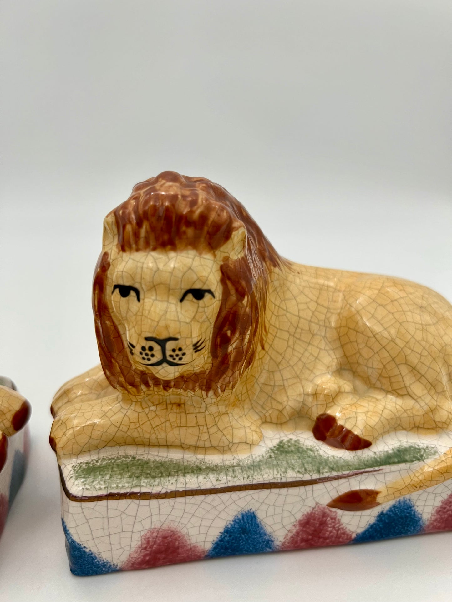 AUTHENTIC PAIR OF ANTIQUE STAFFORDSHIRE RECUMBENT LION FIGURINES, CIRCA 1800s