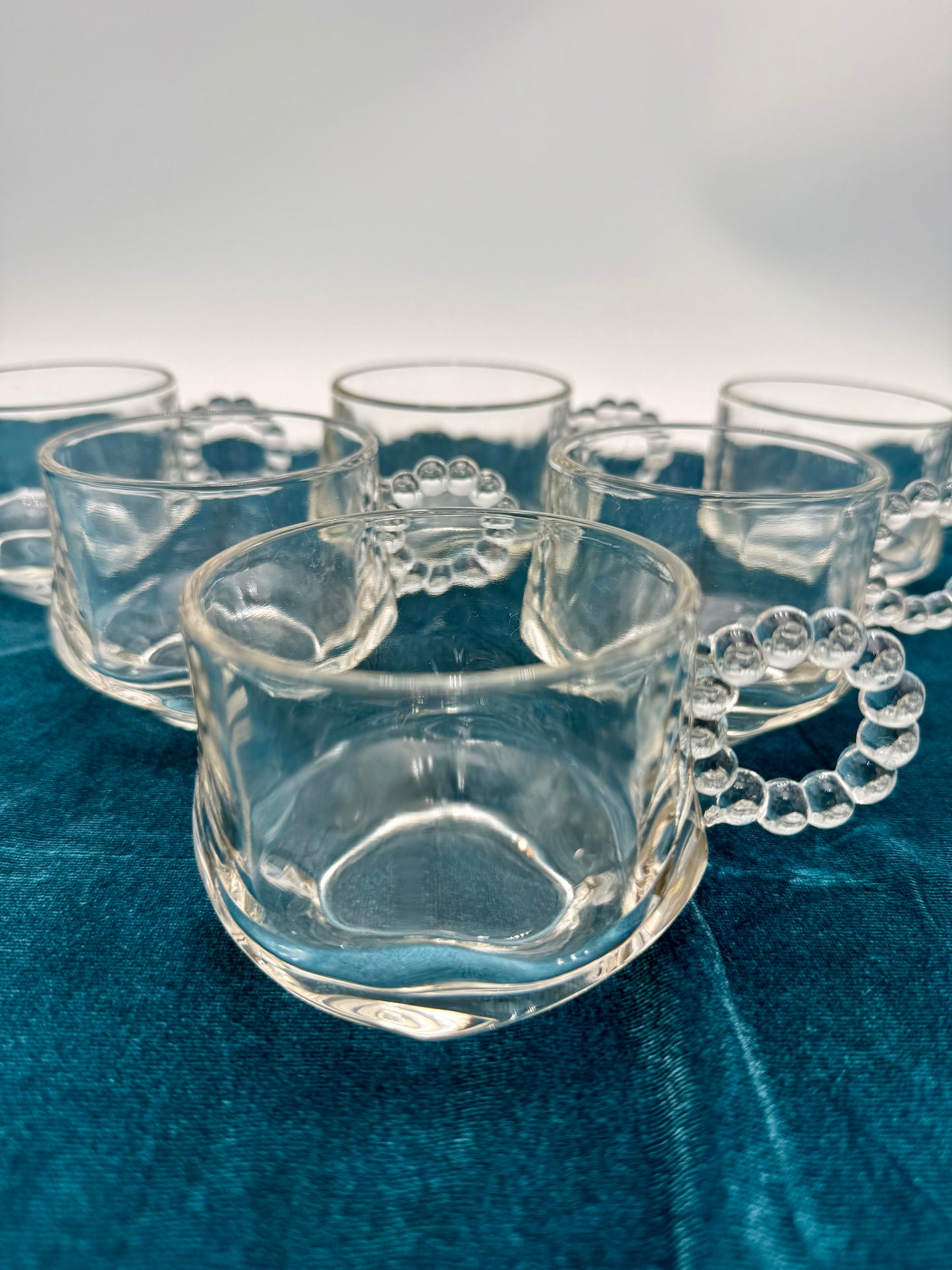 1940s HAZEL ATLAS ORCHARD CRYSTAL GLASS PUNCH CUPS WITH BEADED HANDLES, SET OF 7