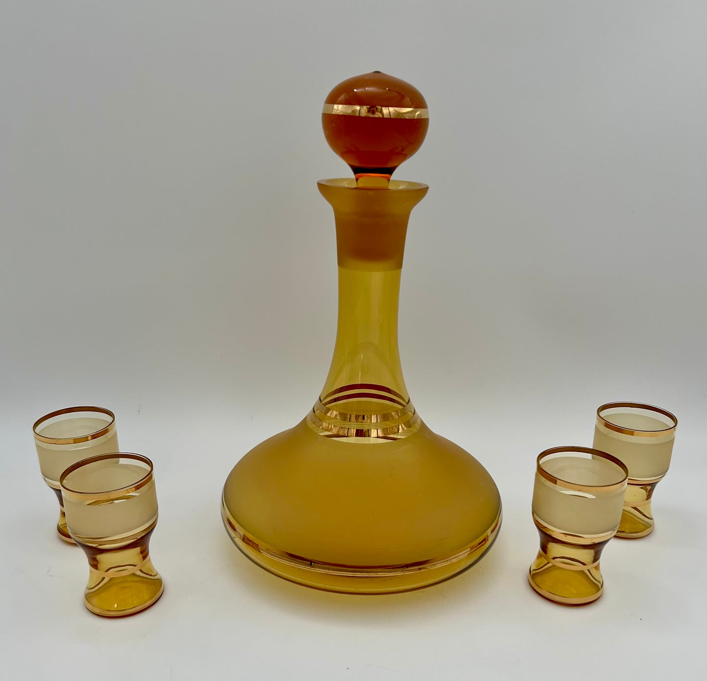 MID CENTURY AMBER AND GOLD CORDIAL LIQUOR DECANTER SET