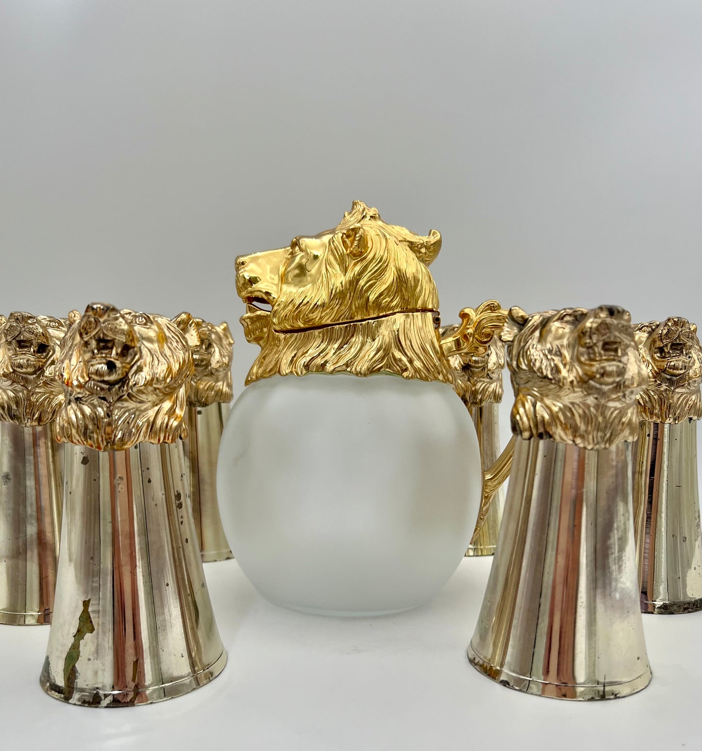 CAROLE STUPELL MID-CENTURY LION HEAD PITCHER AND STIRRUP CUPS, RARE SET OF 7