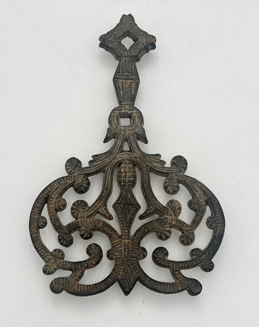 ANTIQUE J.Z.H. CAST IRON TRIVET, CIRCA 1949