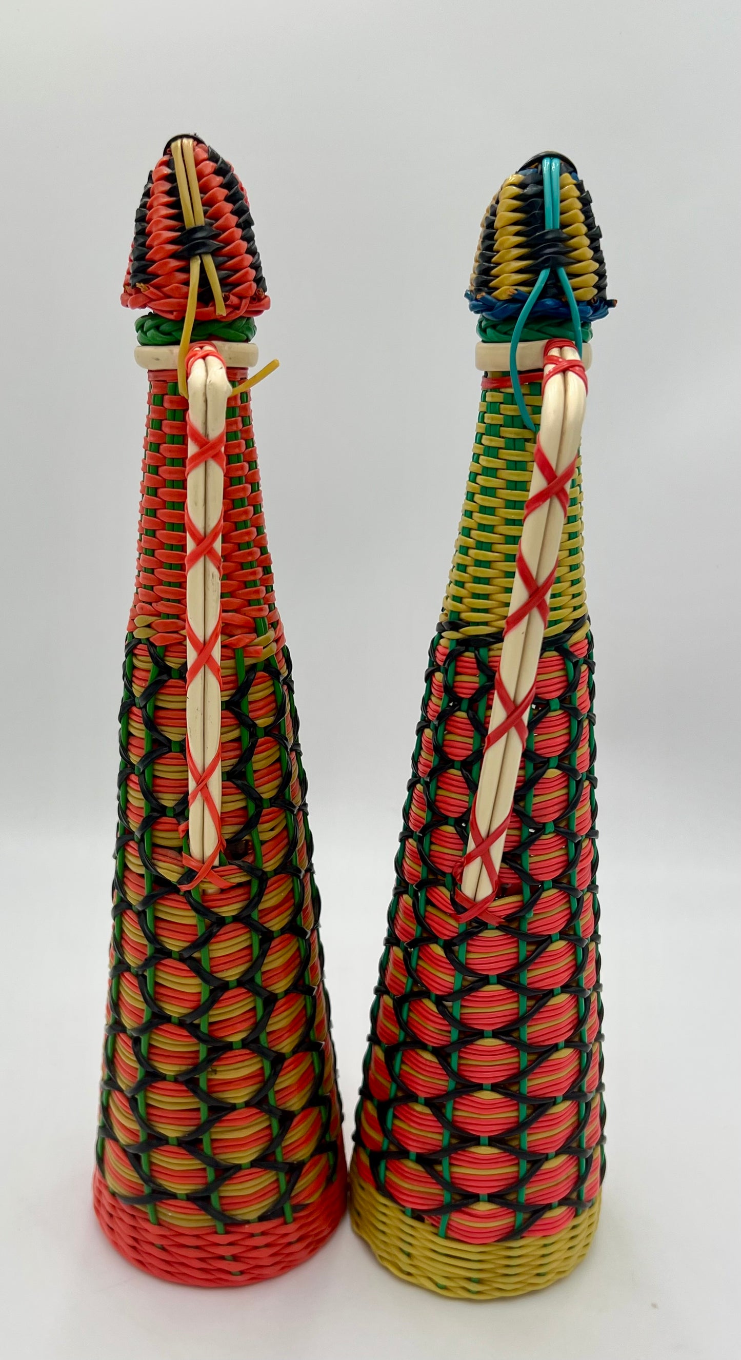 PAIR OF 1960s BOHO SCOUBIDOU WOVEN PLASTIC GLASS BOTTLE DECANTER, SPAIN