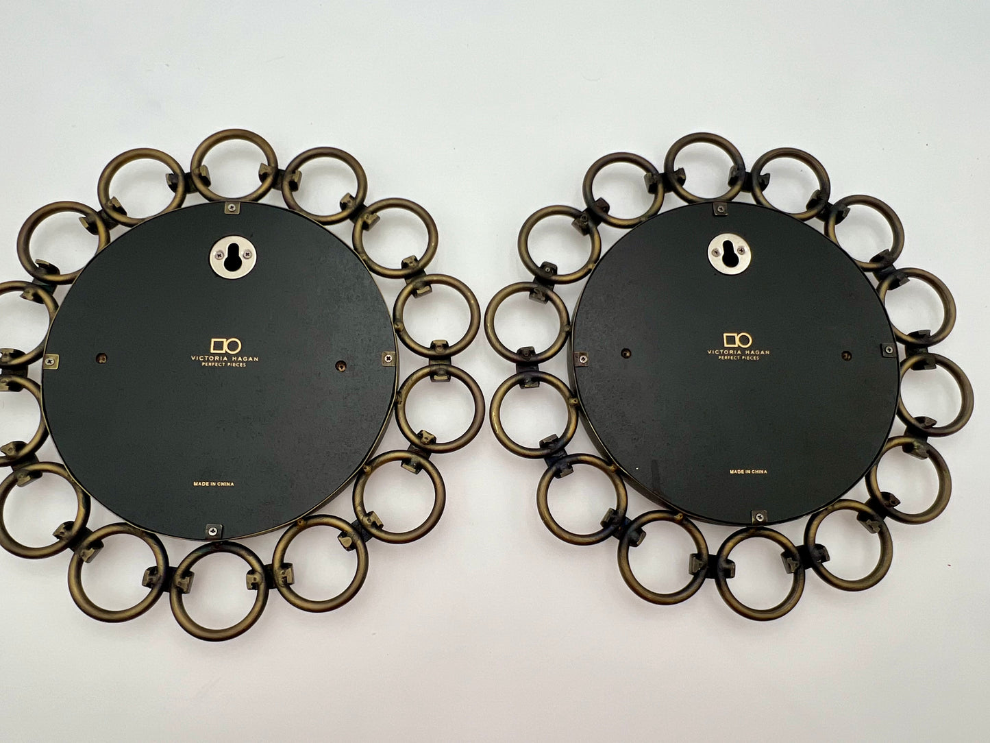 VINTAGE PAIR OF VICTORIA HAGAN CIRCULAR BRASS MIRRORS