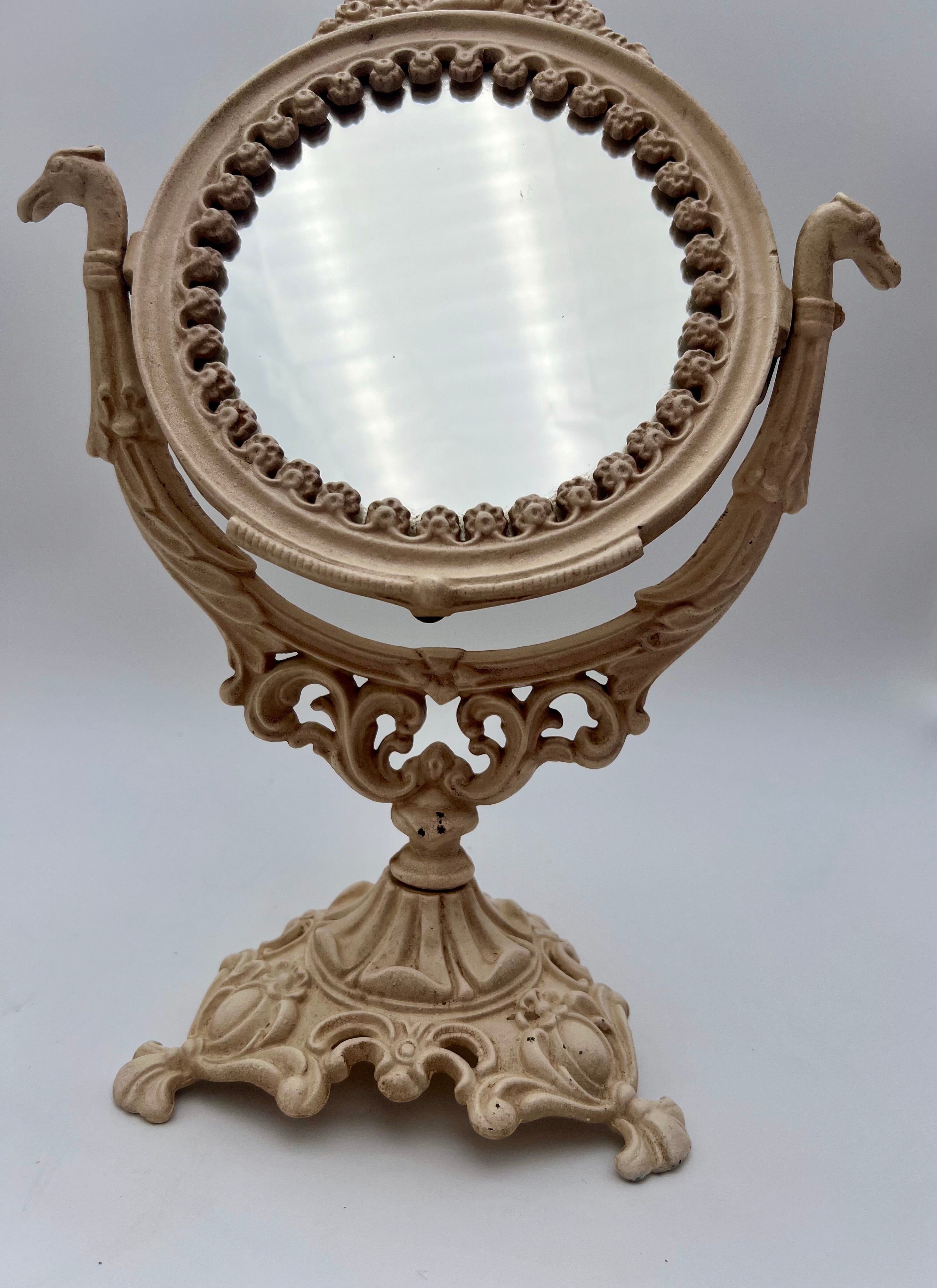 ANTIQUE VANITY TABLE MIRROR WITH DOG HEAD HANDLES & PUTTO CHERUB – ORNATE CAST IRON – 14 ¾ INCH – CIRCA EARLY 1900s