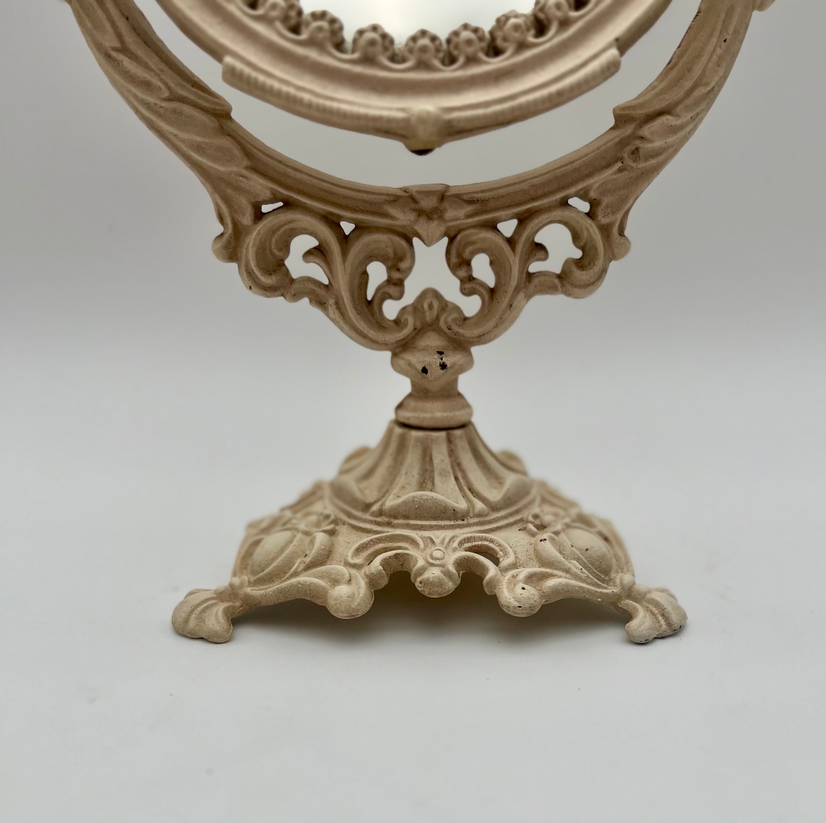 ANTIQUE VANITY TABLE MIRROR WITH DOG HEAD HANDLES & PUTTO CHERUB – ORNATE CAST IRON – 14 ¾ INCH – CIRCA EARLY 1900s