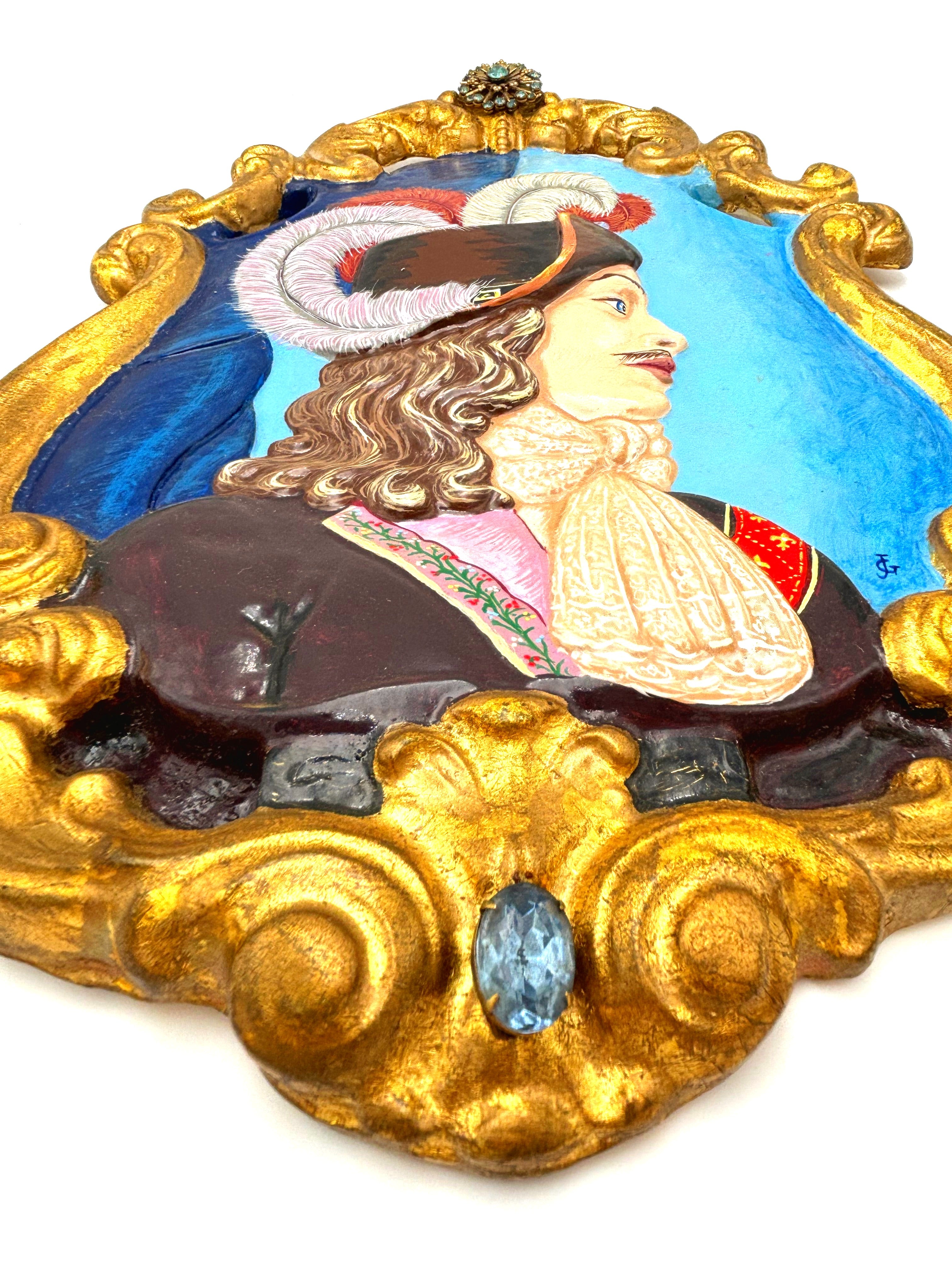 VINTAGE HAND PAINTED CAVALIER WALL PLAQUE WITH JEWELED GOLD ROCOCO FRAME