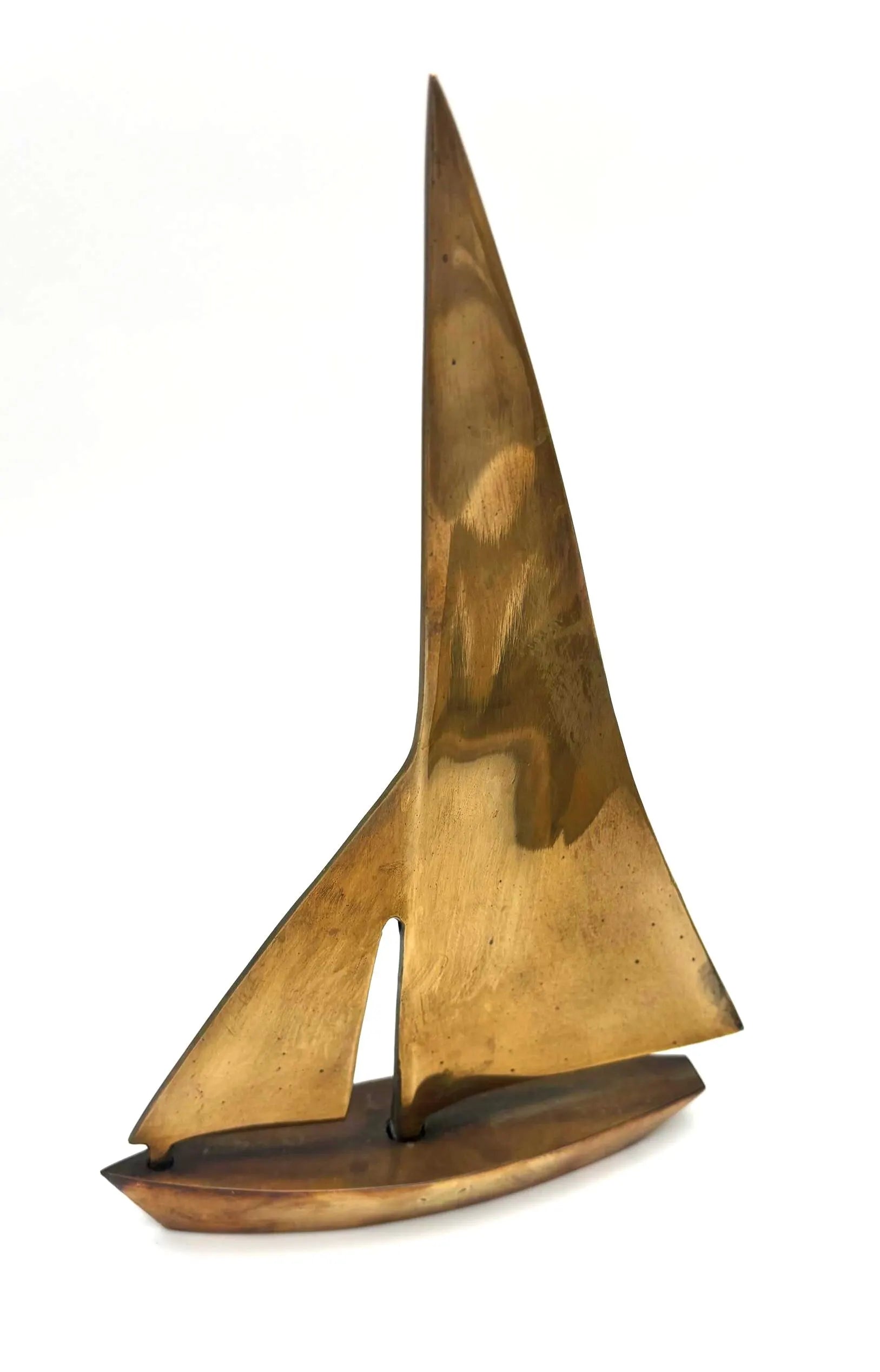 VINTAGE SOLID BRASS SAILBOAT SCULPTURES – COLLECTION OF FOUR MODERNIST YACHTS