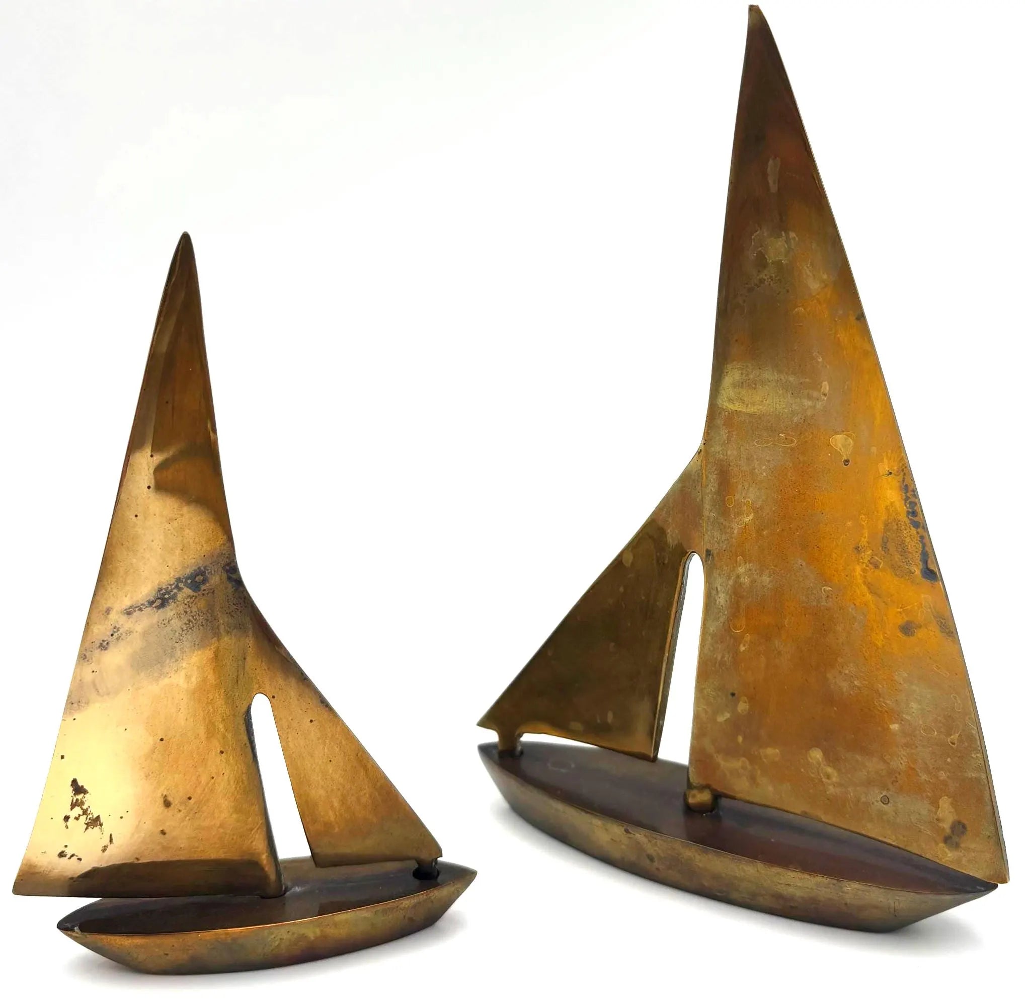 VINTAGE SOLID BRASS SAILBOAT SCULPTURES – COLLECTION OF FOUR MODERNIST YACHTS