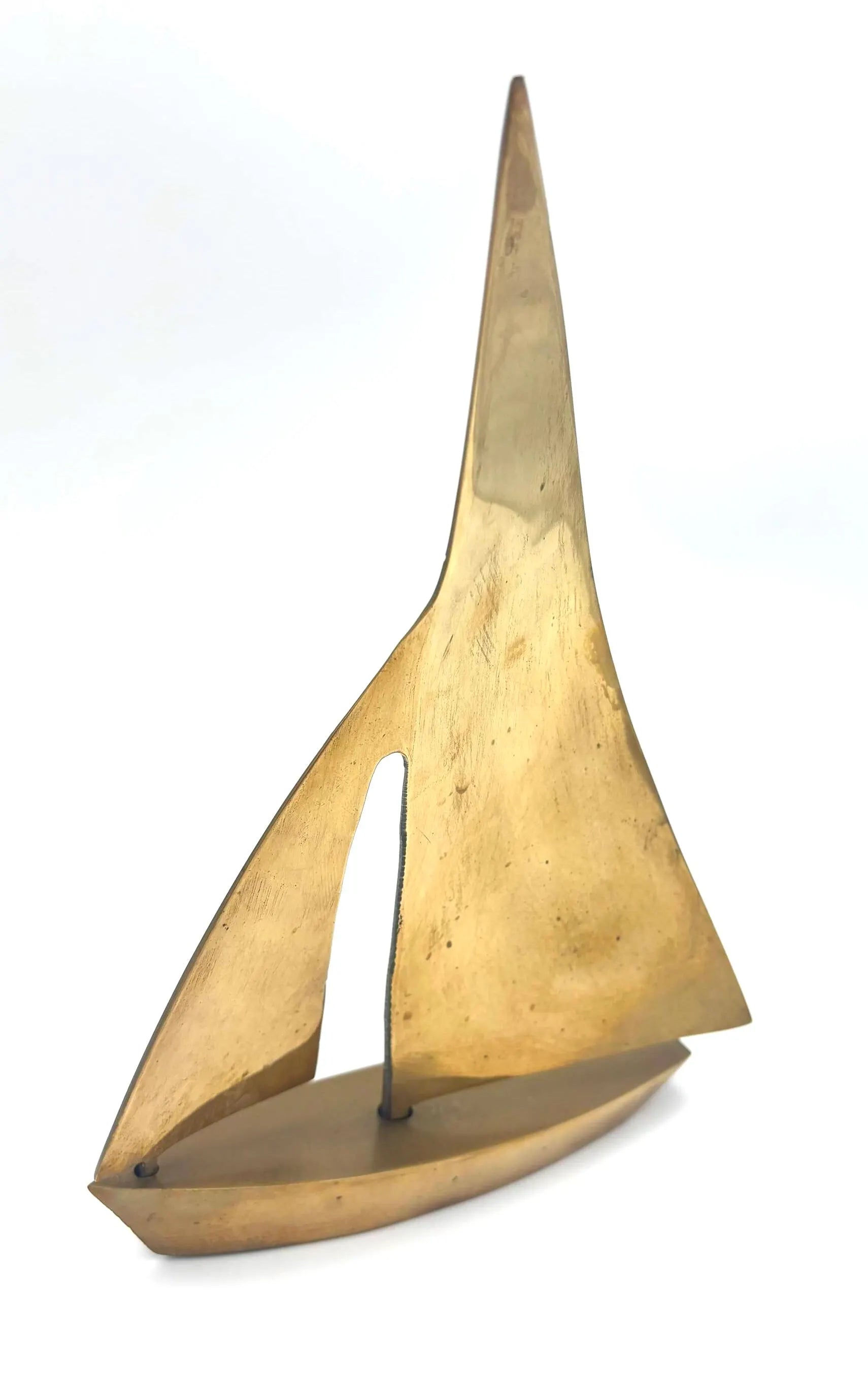 VINTAGE SOLID BRASS SAILBOAT SCULPTURES – COLLECTION OF FOUR MODERNIST YACHTS