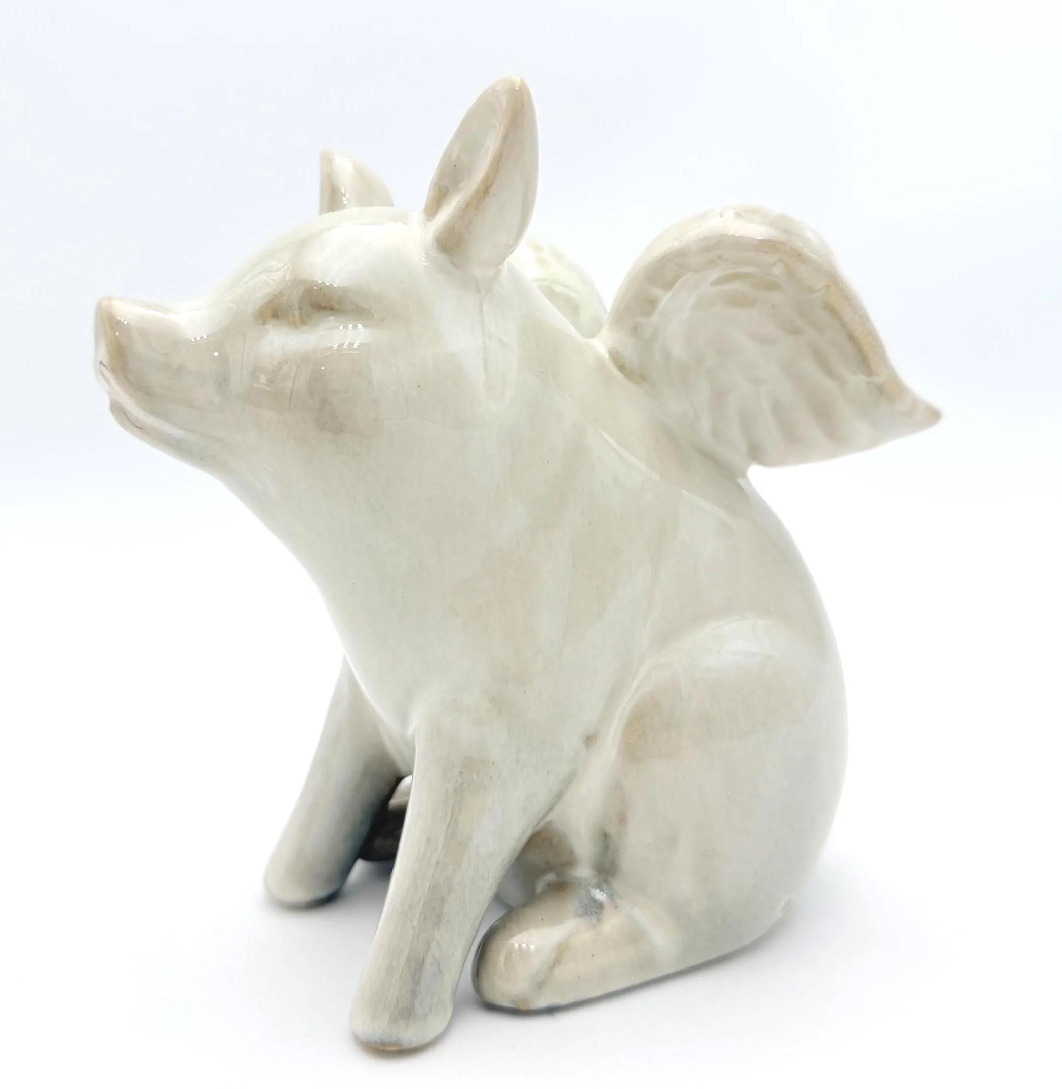 VINTAGE IVORY CERAMIC FLYING PIG FIGURINE