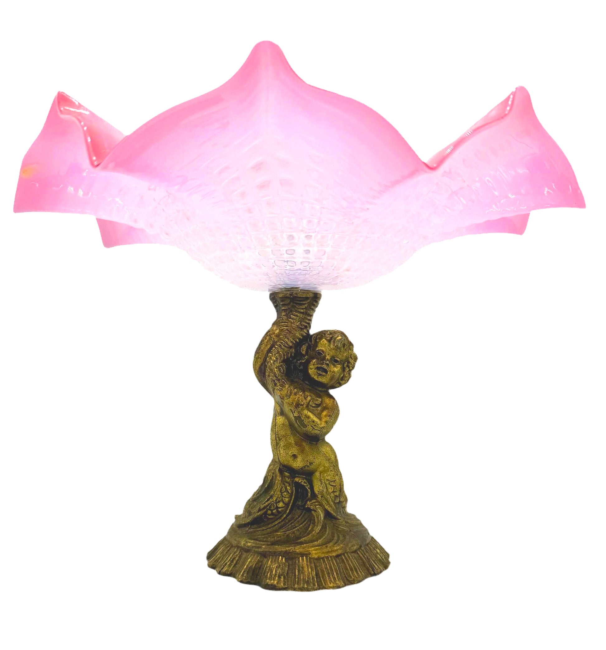 Large Victorian-era cranberry art glass compote with a ruffled edge and an ornate cherub-themed base.