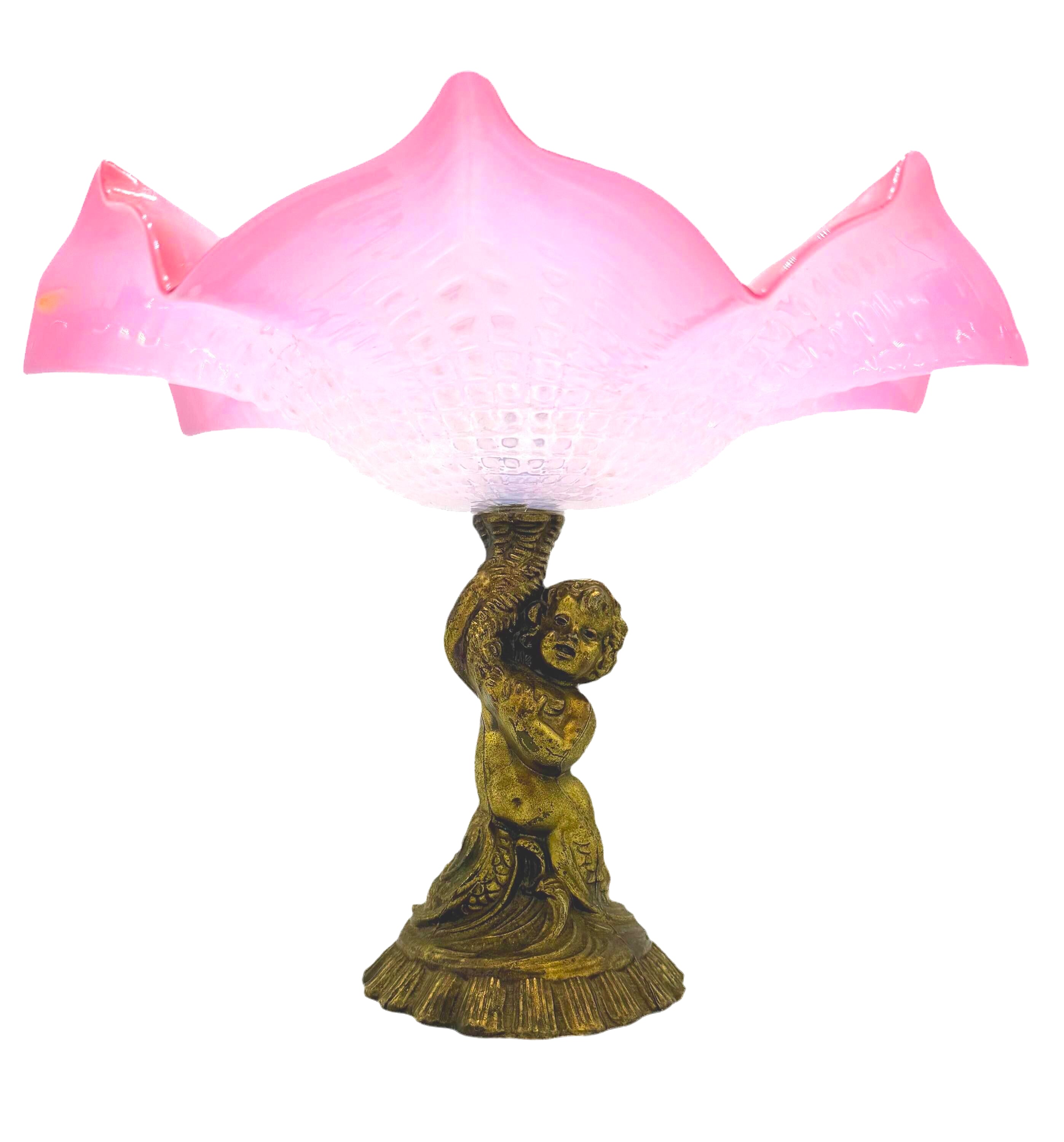 Large Victorian-era cranberry art glass compote with a ruffled edge and an ornate cherub-themed base.