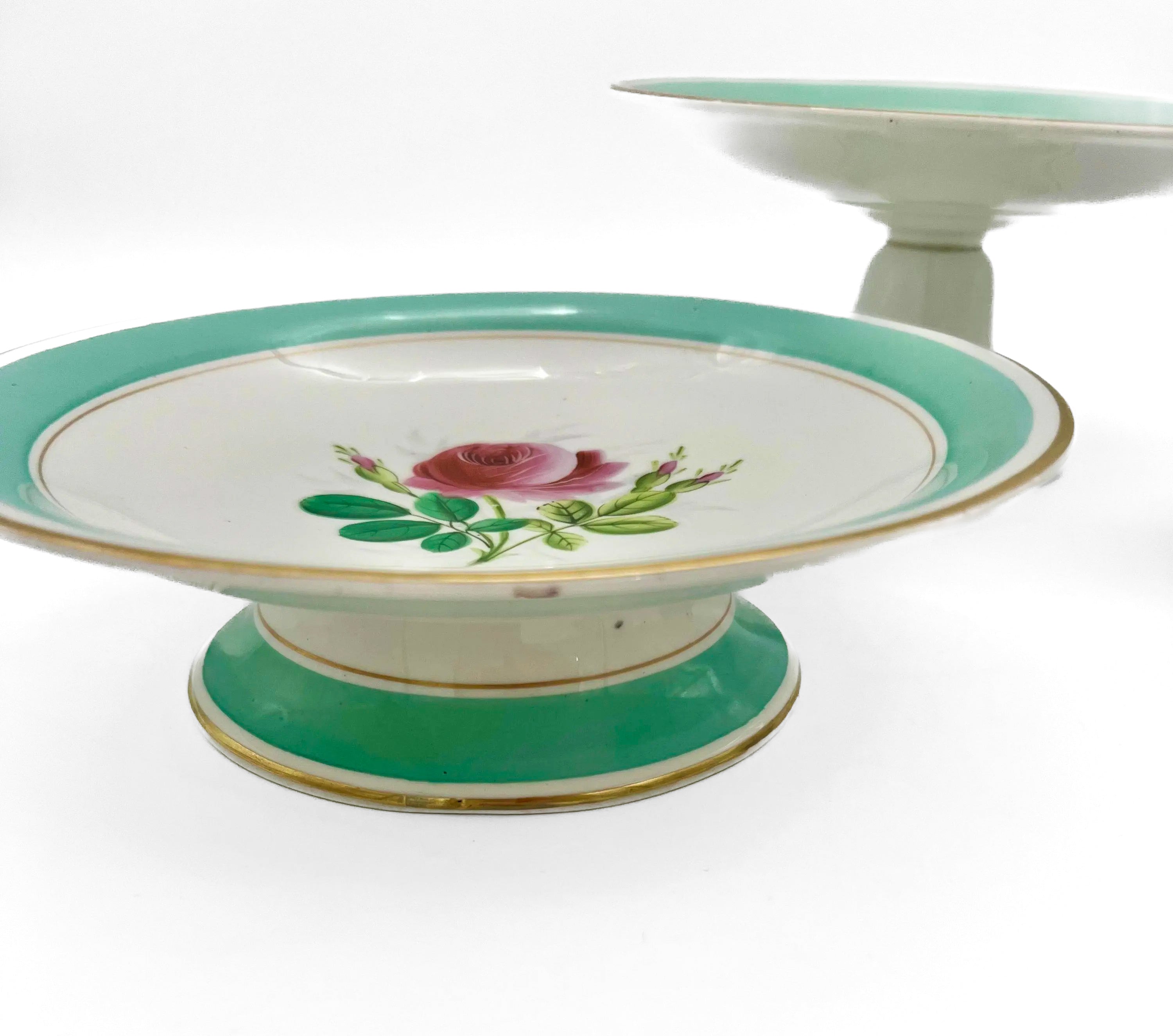 Trio of 1880s English Victorian ceramic compotes featuring hand-painted floral bouquets and pedestal bases.
