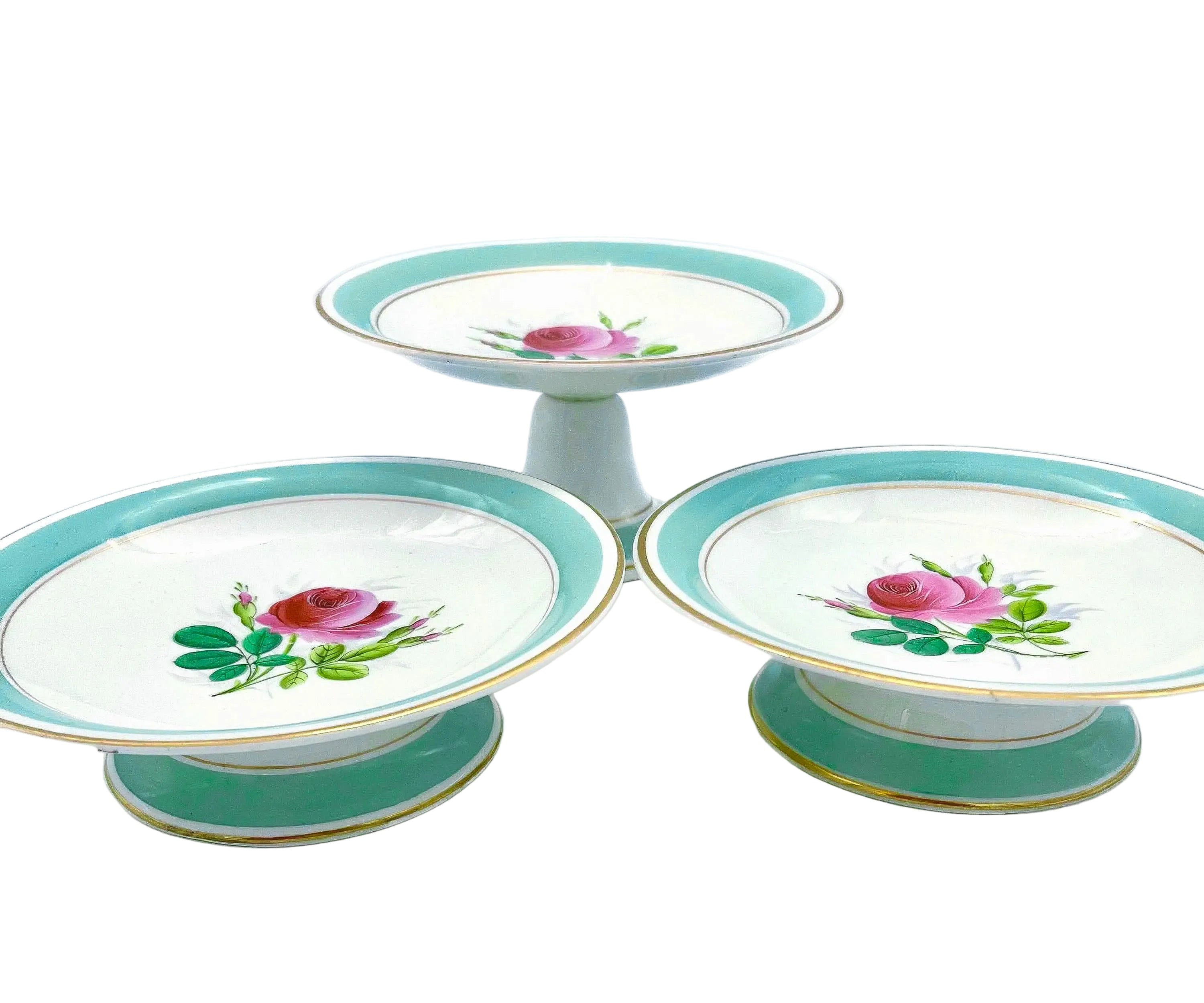 Trio of 1880s English Victorian ceramic compotes featuring hand-painted floral bouquets and pedestal bases.