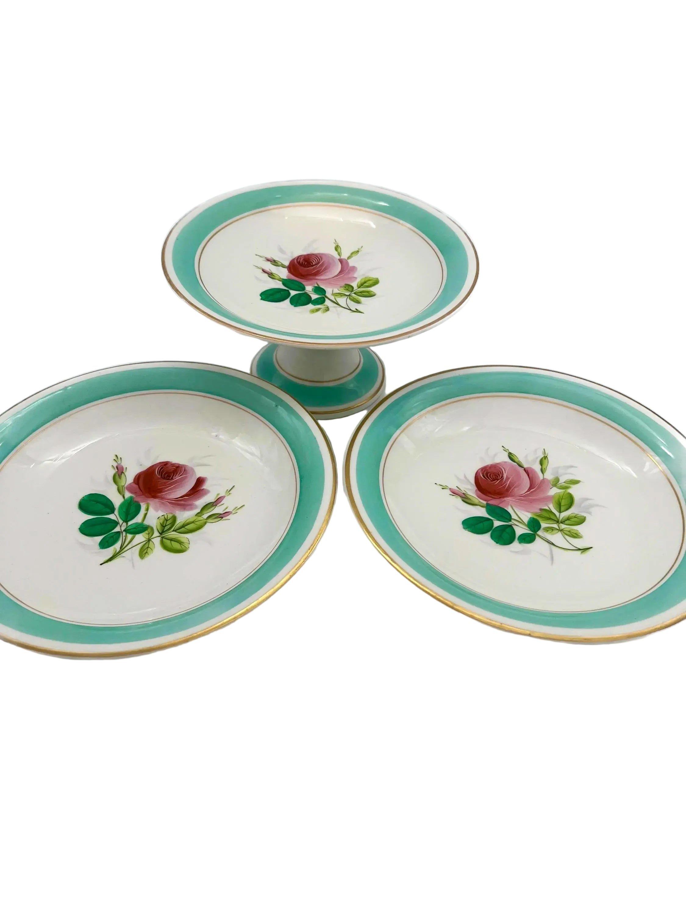 Trio of 1880s English Victorian ceramic compotes featuring hand-painted floral bouquets and pedestal bases.