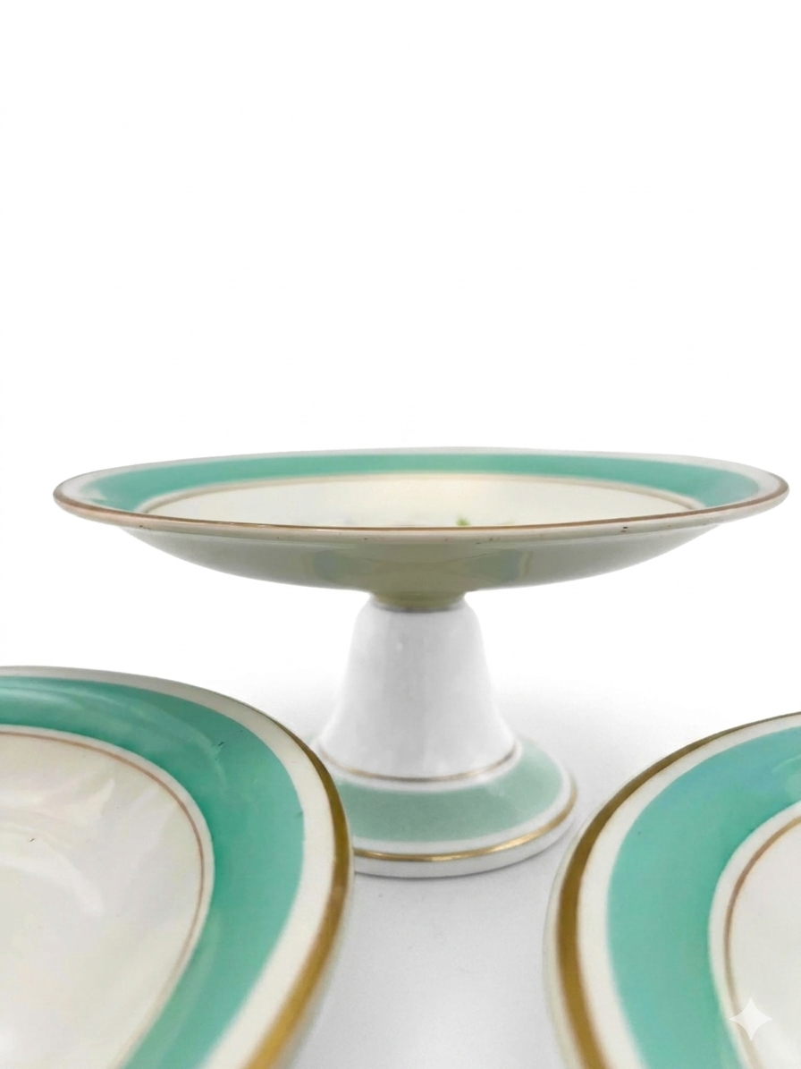 Trio of 1880s English Victorian ceramic compotes featuring hand-painted floral bouquets and pedestal bases.