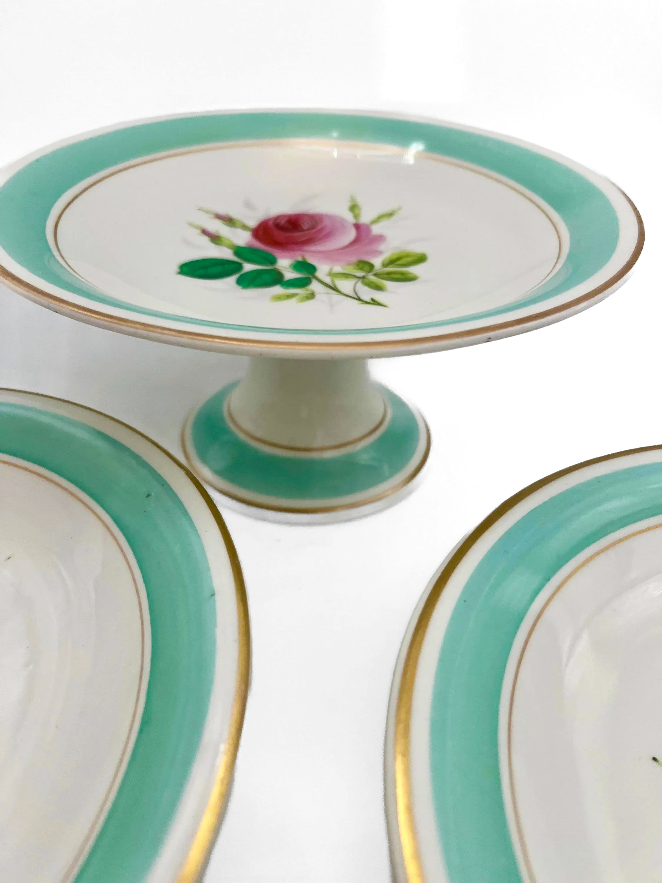 Trio of 1880s English Victorian ceramic compotes featuring hand-painted floral bouquets and pedestal bases.