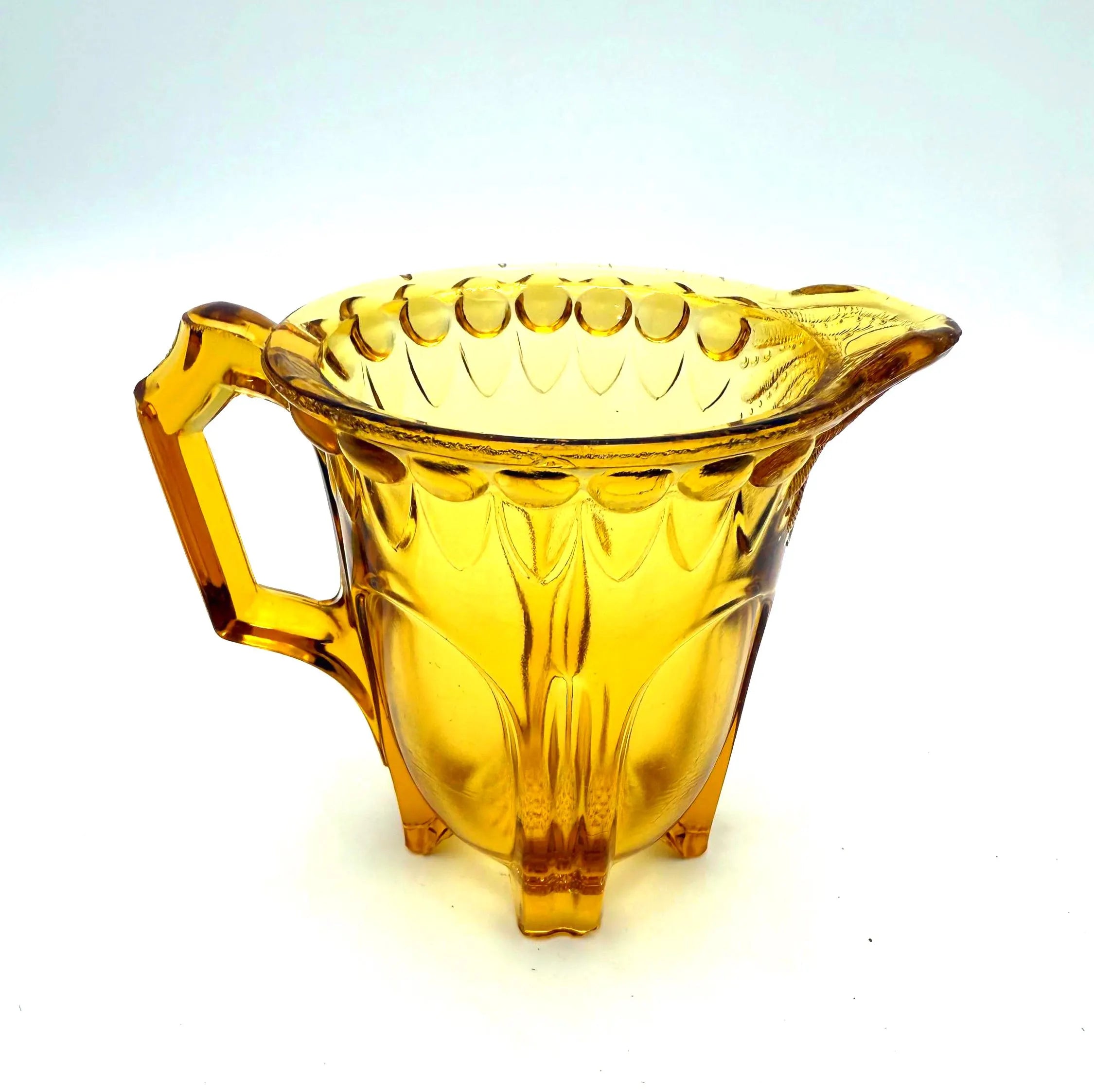 VINTAGE AMBER DEPRESSION GLASS FOOTED CREAMER PITCHER WITH SCALLOPED RIM – ART DECO ERA