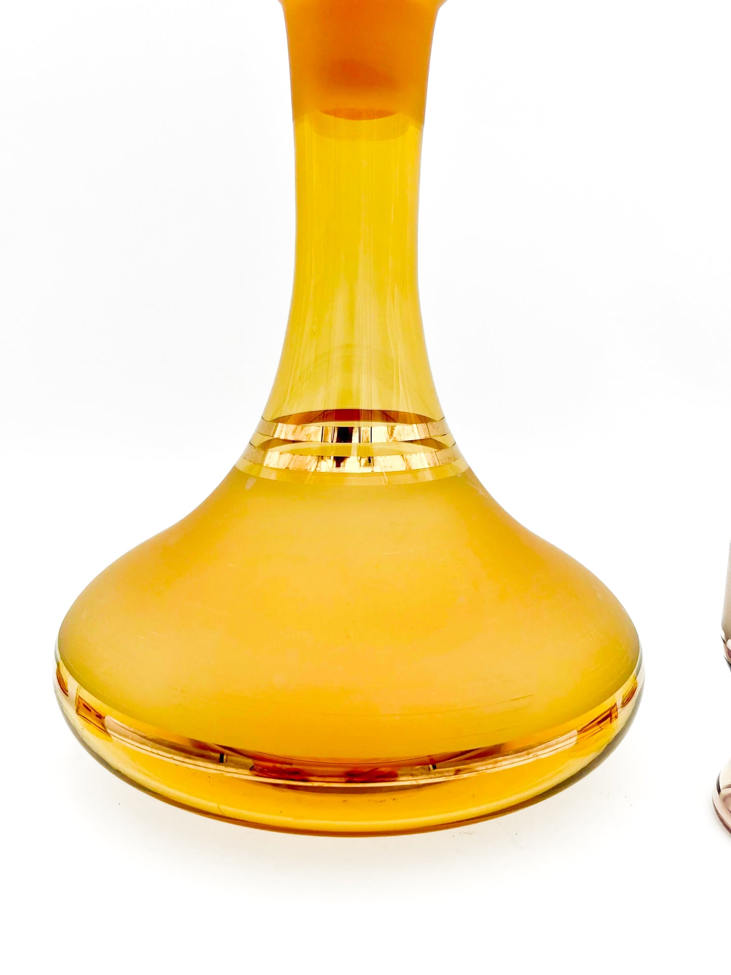 Vintage mid-century cordial set featuring an amber glass decanter with elegant gold filigree accents.