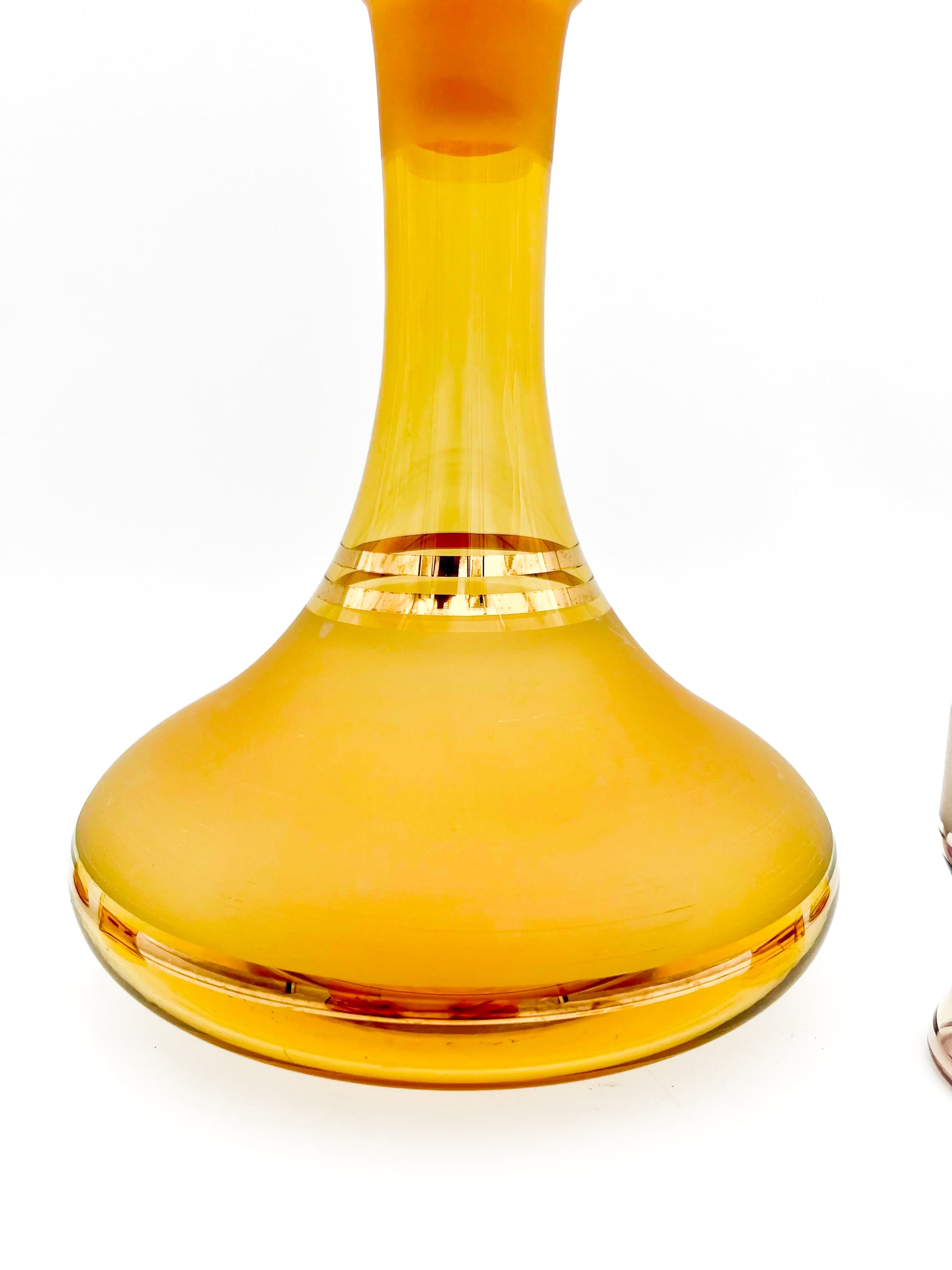 Vintage mid-century cordial set featuring an amber glass decanter with elegant gold filigree accents.