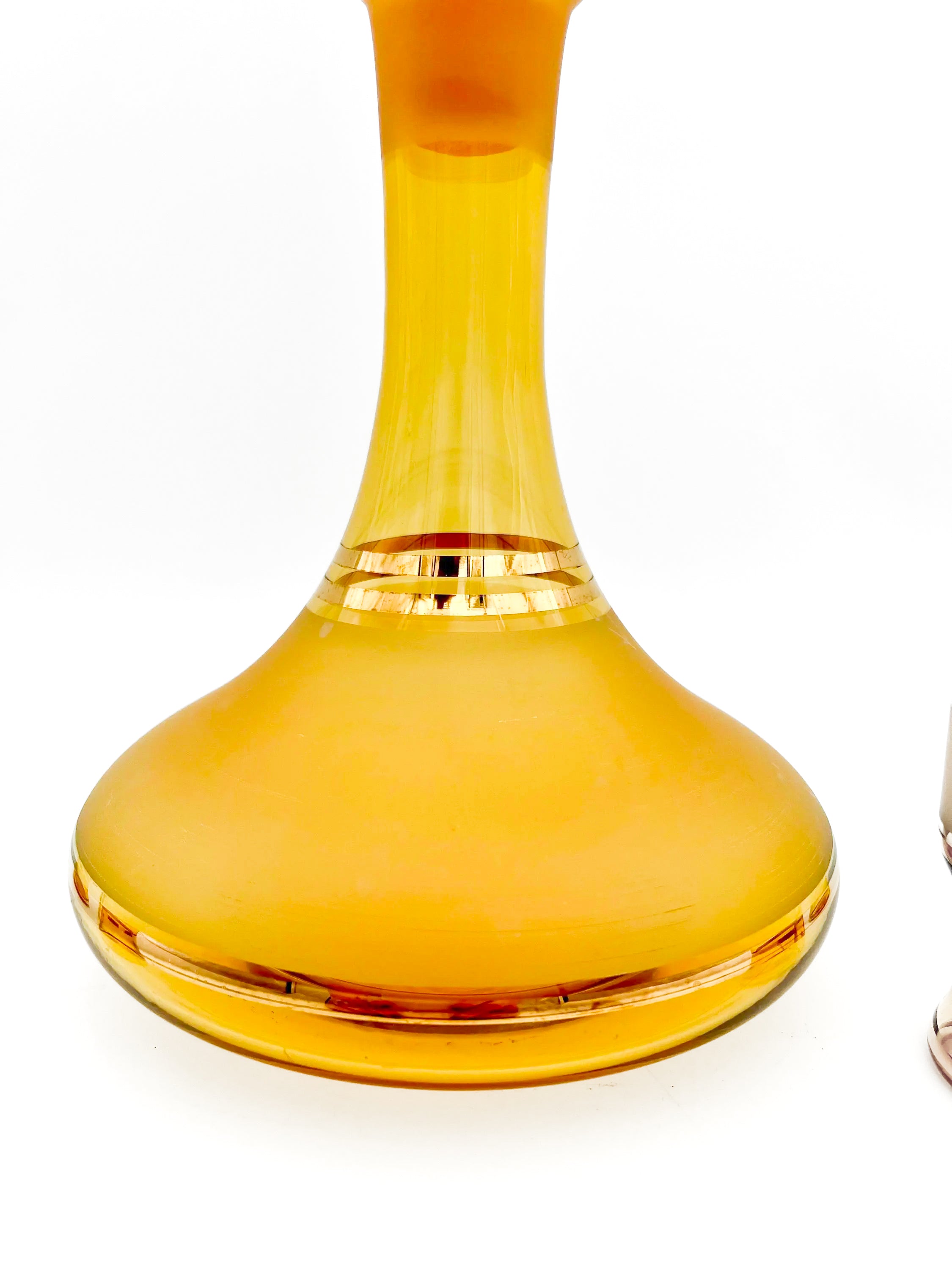 Vintage mid-century cordial set featuring an amber glass decanter with elegant gold filigree accents.