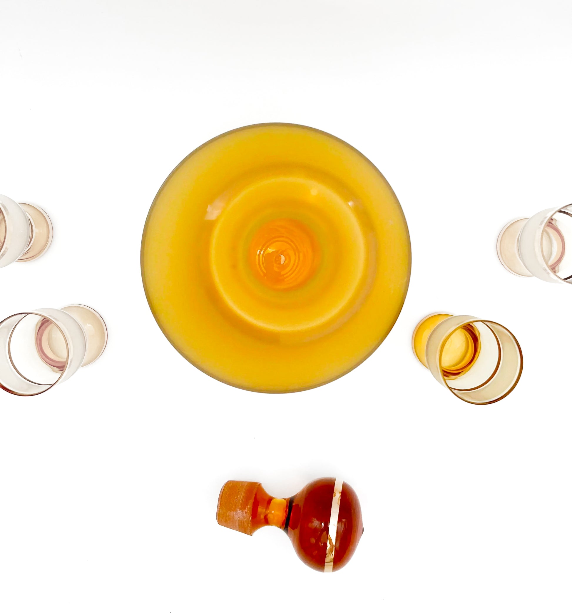 Vintage mid-century cordial set featuring an amber glass decanter with elegant gold filigree accents.