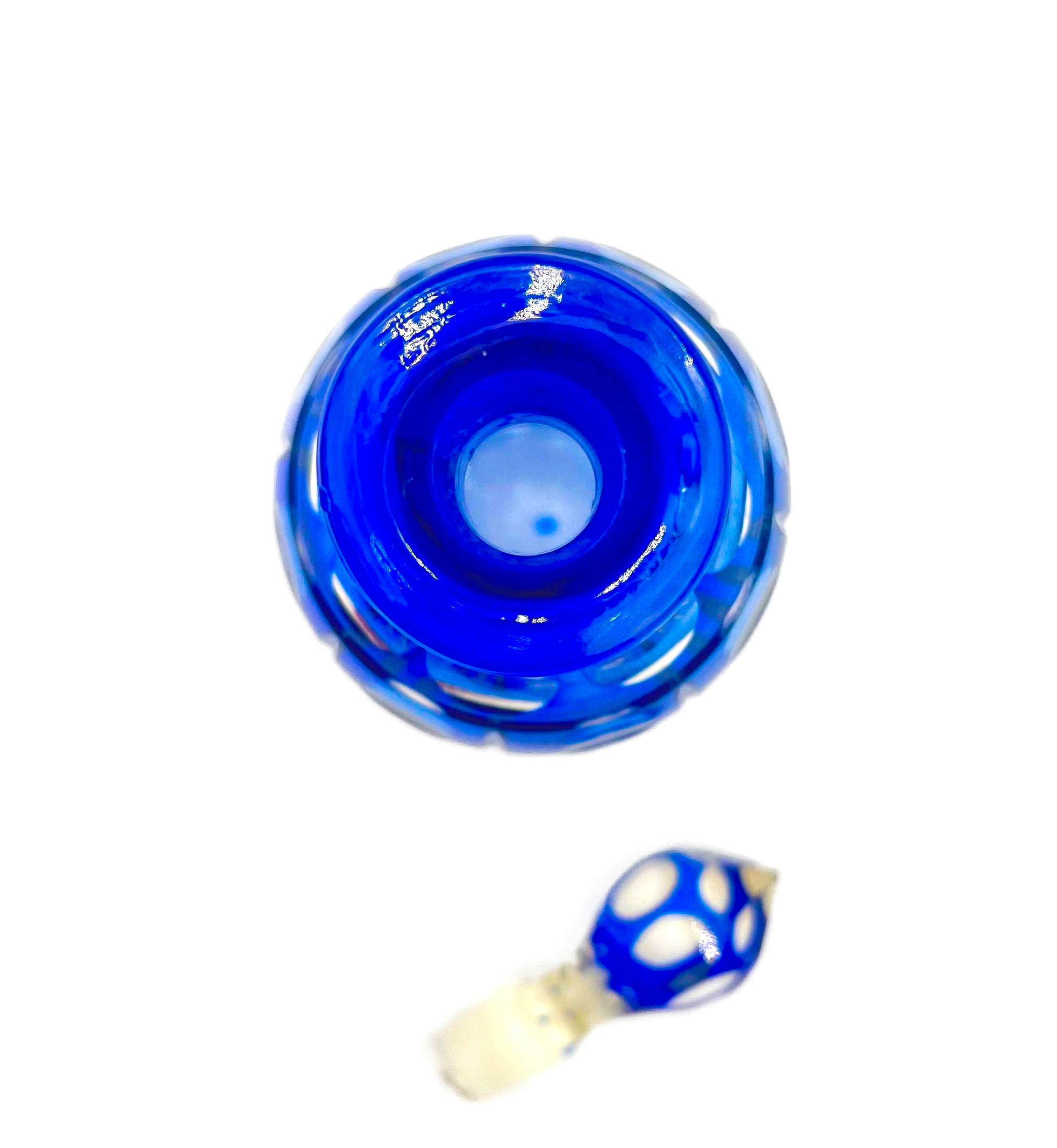 Minimalist mid-century modern decanter in a deep cobalt blue glass with a matching round stopper.
