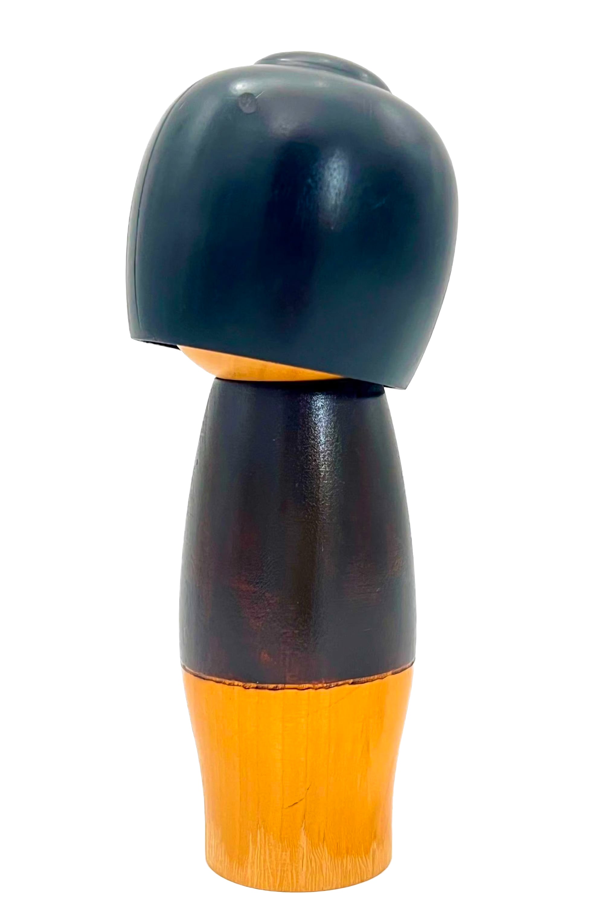 Traditional vintage Japanese Kokeshi doll made of hand-painted wood with floral accents.
