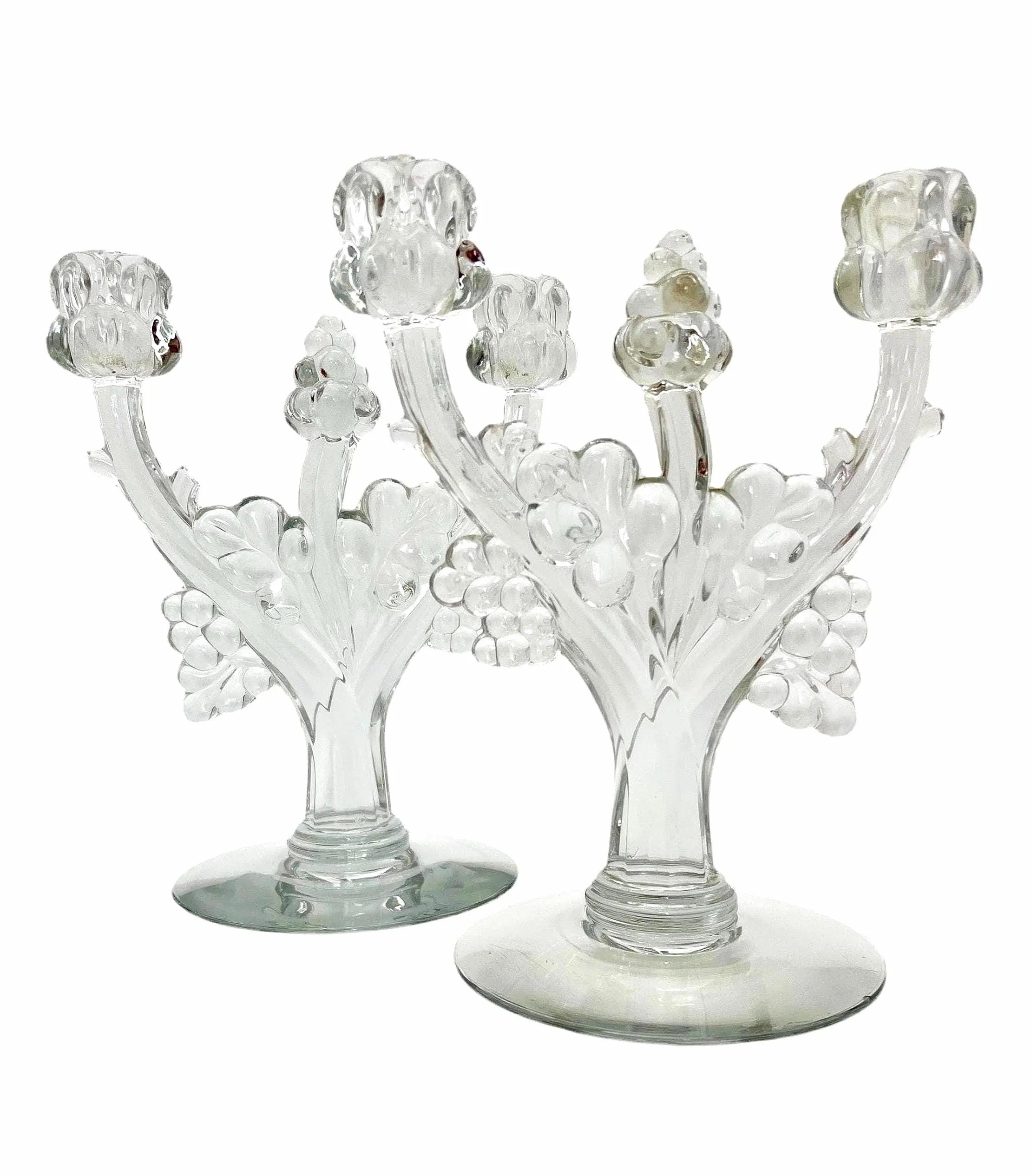 Pair of 1930s Heisey glass candelabras featuring rare molded grape cluster designs and elegant glass arms.