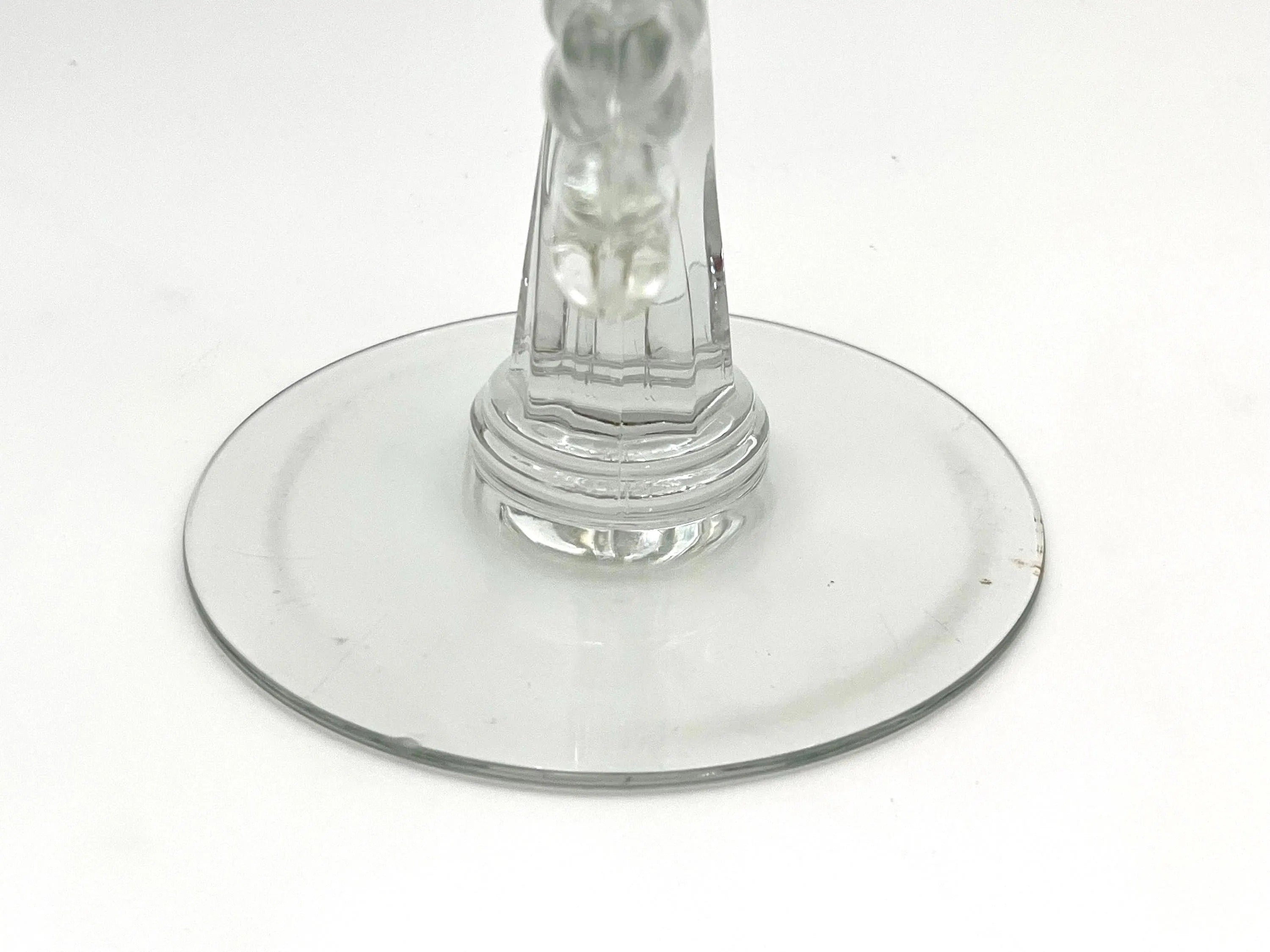 Pair of 1930s Heisey glass candelabras featuring rare molded grape cluster designs and elegant glass arms.