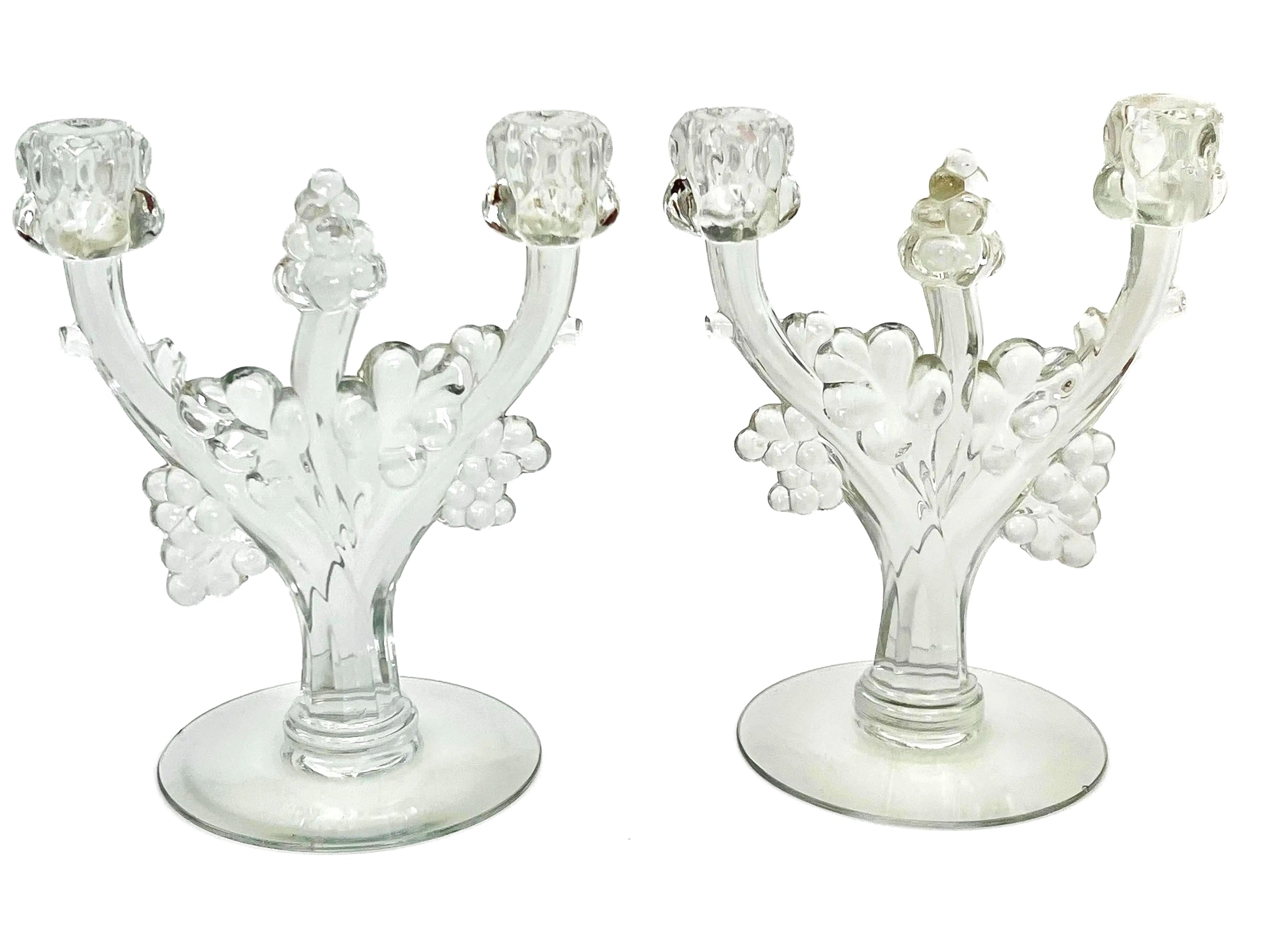 Pair of 1930s Heisey glass candelabras featuring rare molded grape cluster designs and elegant glass arms.