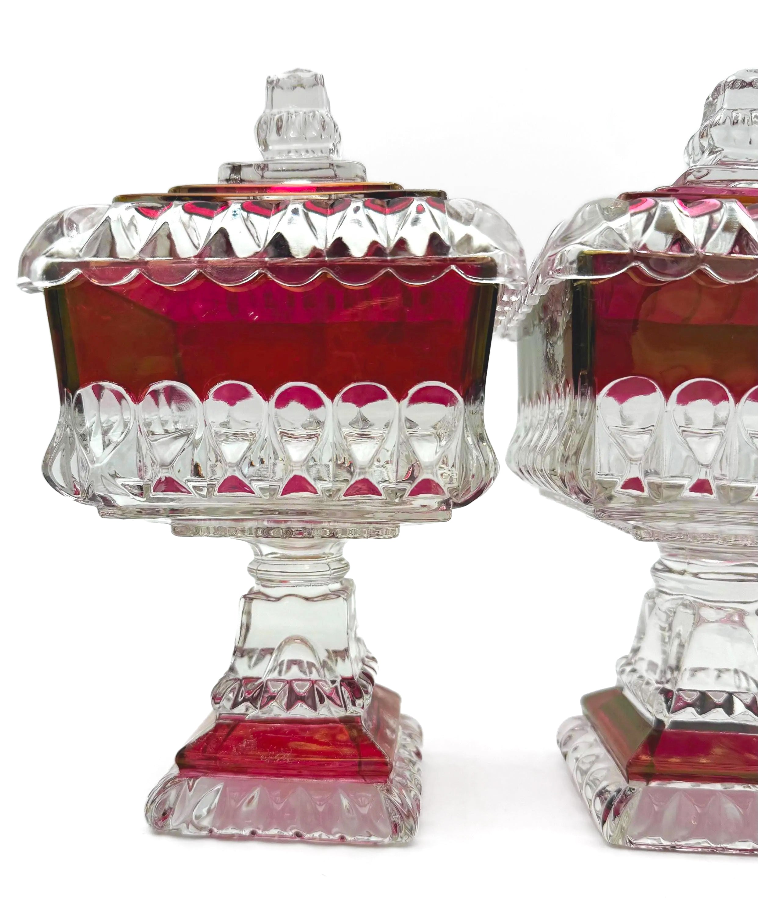 1890s Victorian ruby-stained EAPG pedestal compotes with lids, manufactured by U.S. Glass.