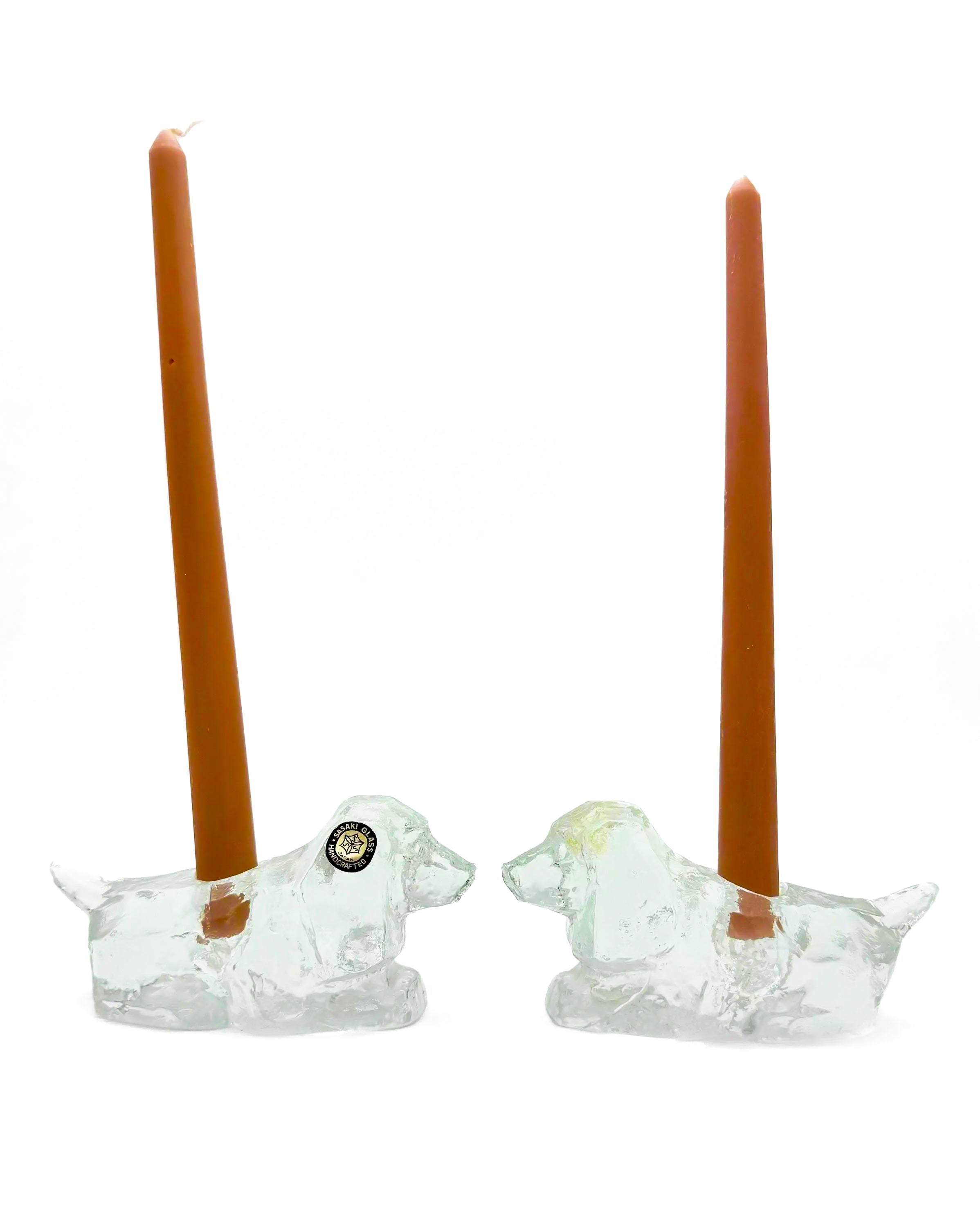 Pair of vintage heavy lead crystal candlestick holders shaped like sitting puppies.