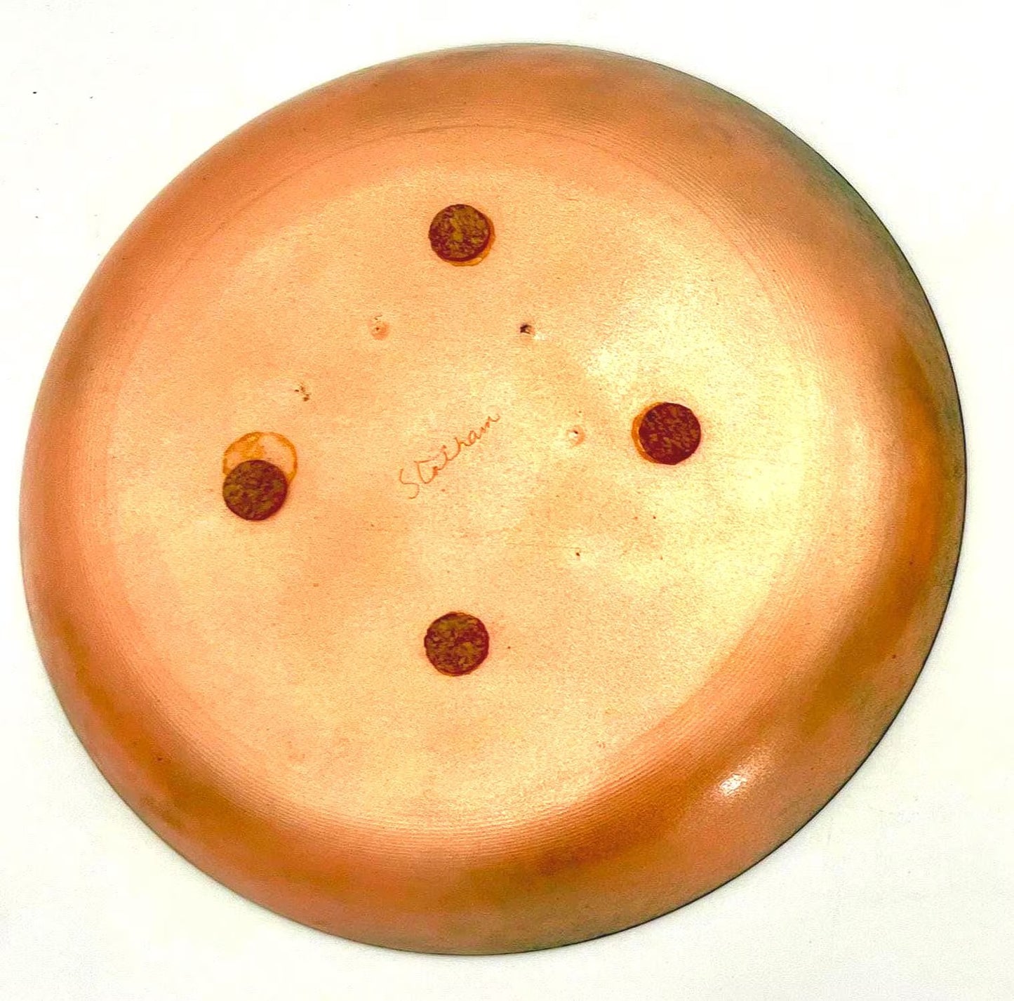 Pair of vintage copper wall art plates with mid-century designs, signed by Statham.