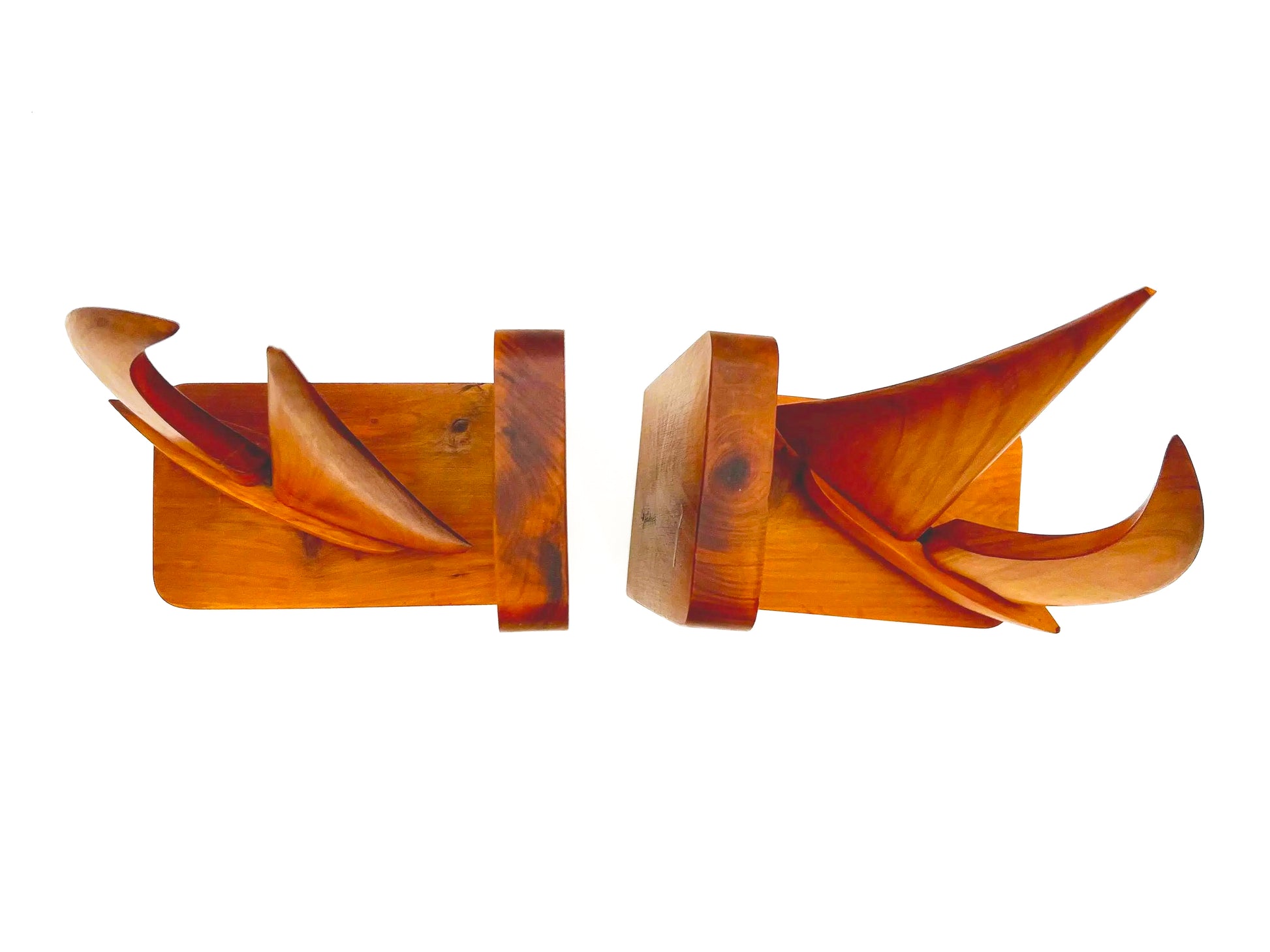 Pair of 1965 mid-century modern teak wood bookends carved in the shape of sailboats.