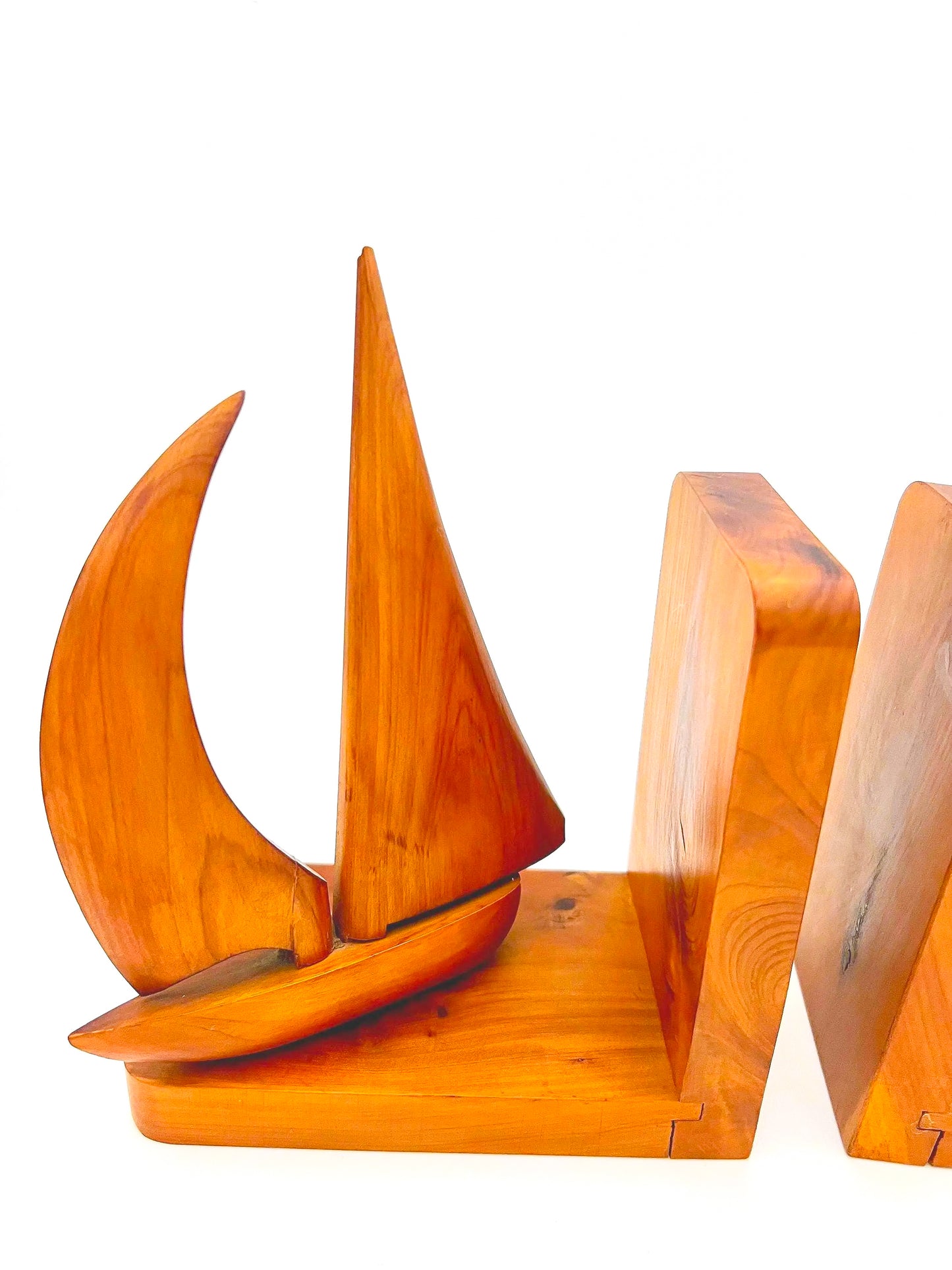 Pair of 1965 mid-century modern teak wood bookends carved in the shape of sailboats.