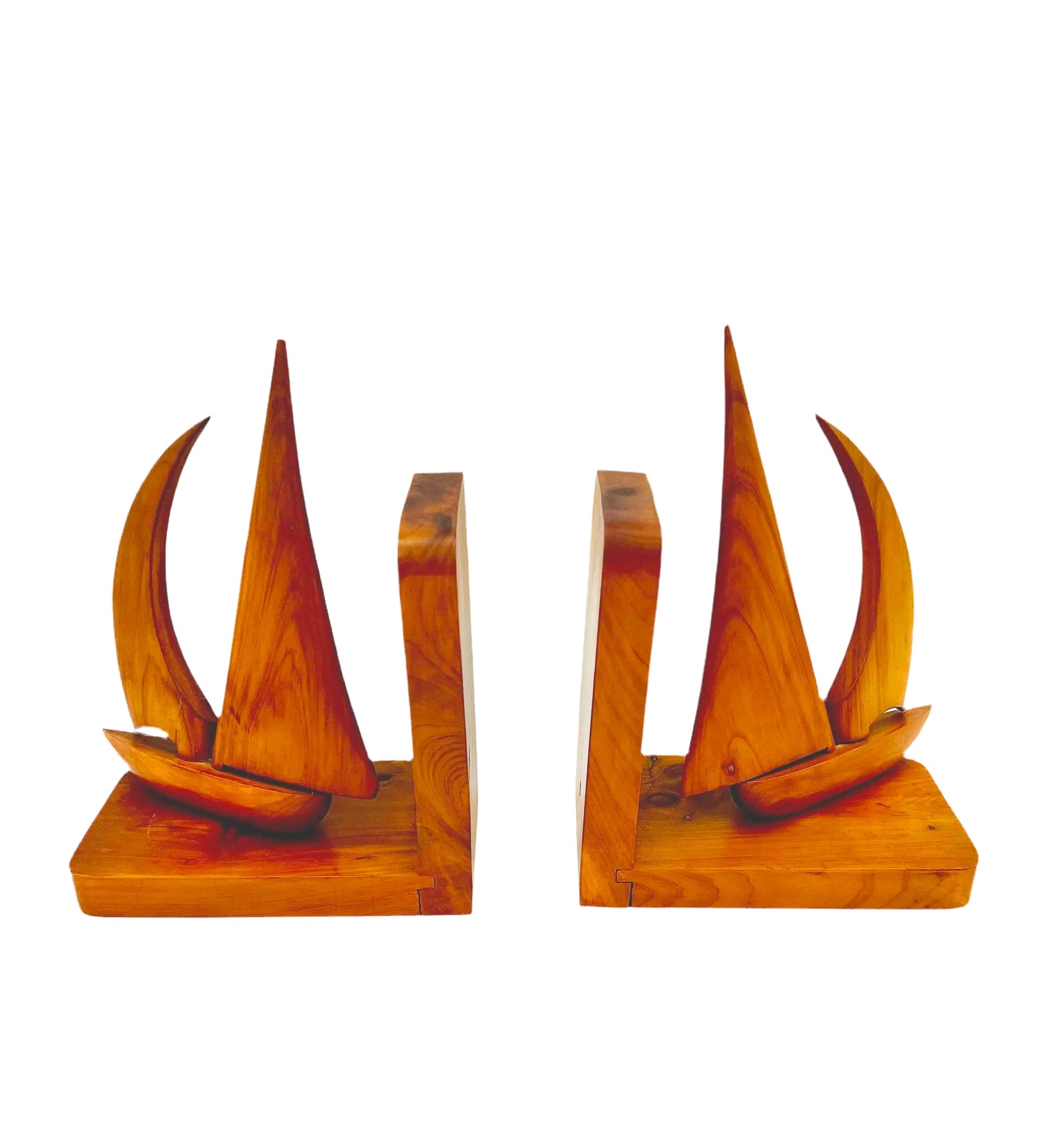 Pair of 1965 mid-century modern teak wood bookends carved in the shape of sailboats.
