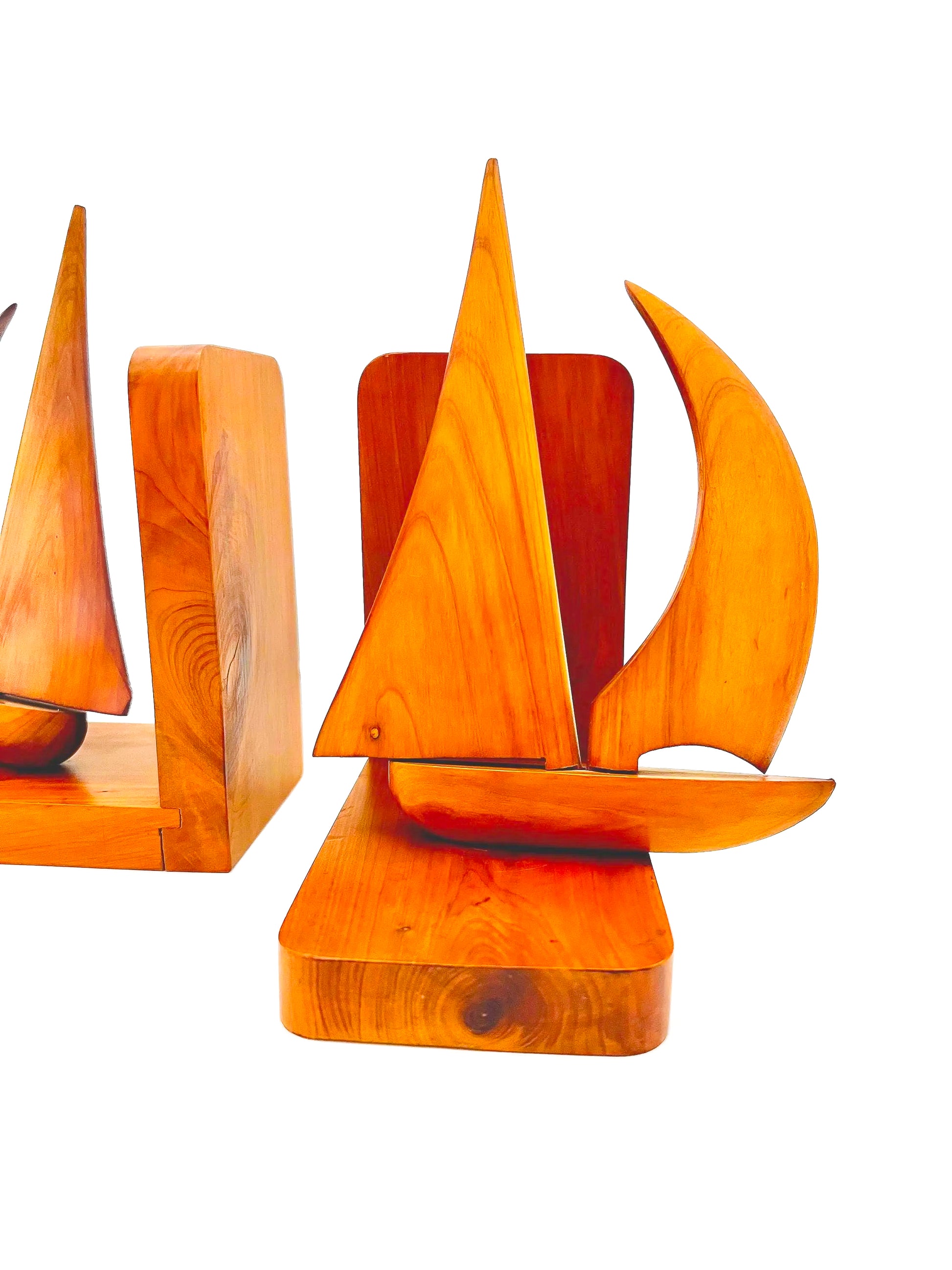 Pair of 1965 mid-century modern teak wood bookends carved in the shape of sailboats.