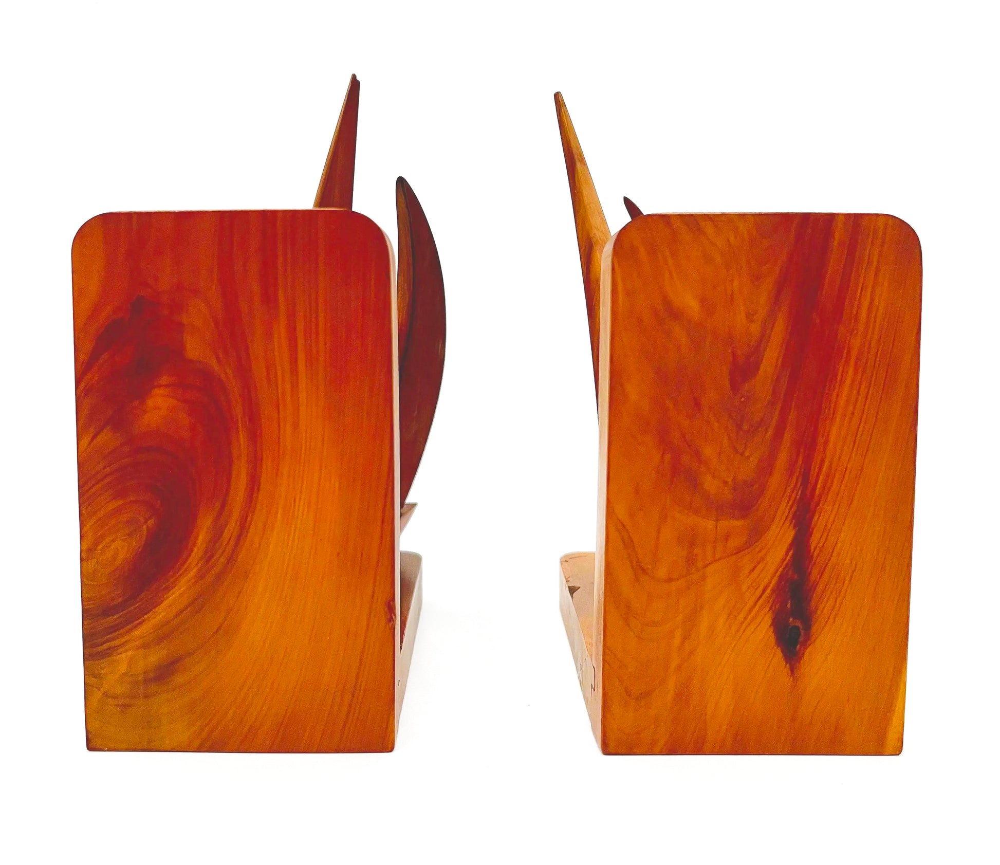 Pair of 1965 mid-century modern teak wood bookends carved in the shape of sailboats.