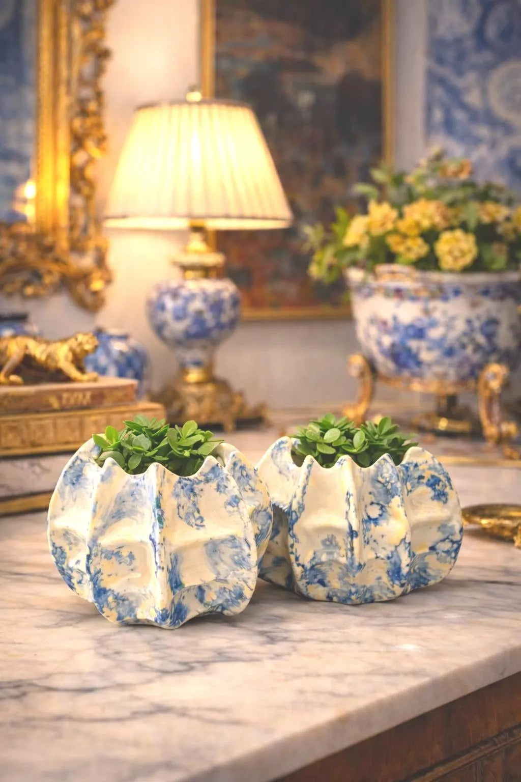 Pair of vintage ceramic planters or candle holders with an abstract blue and white splatter-ware pattern.