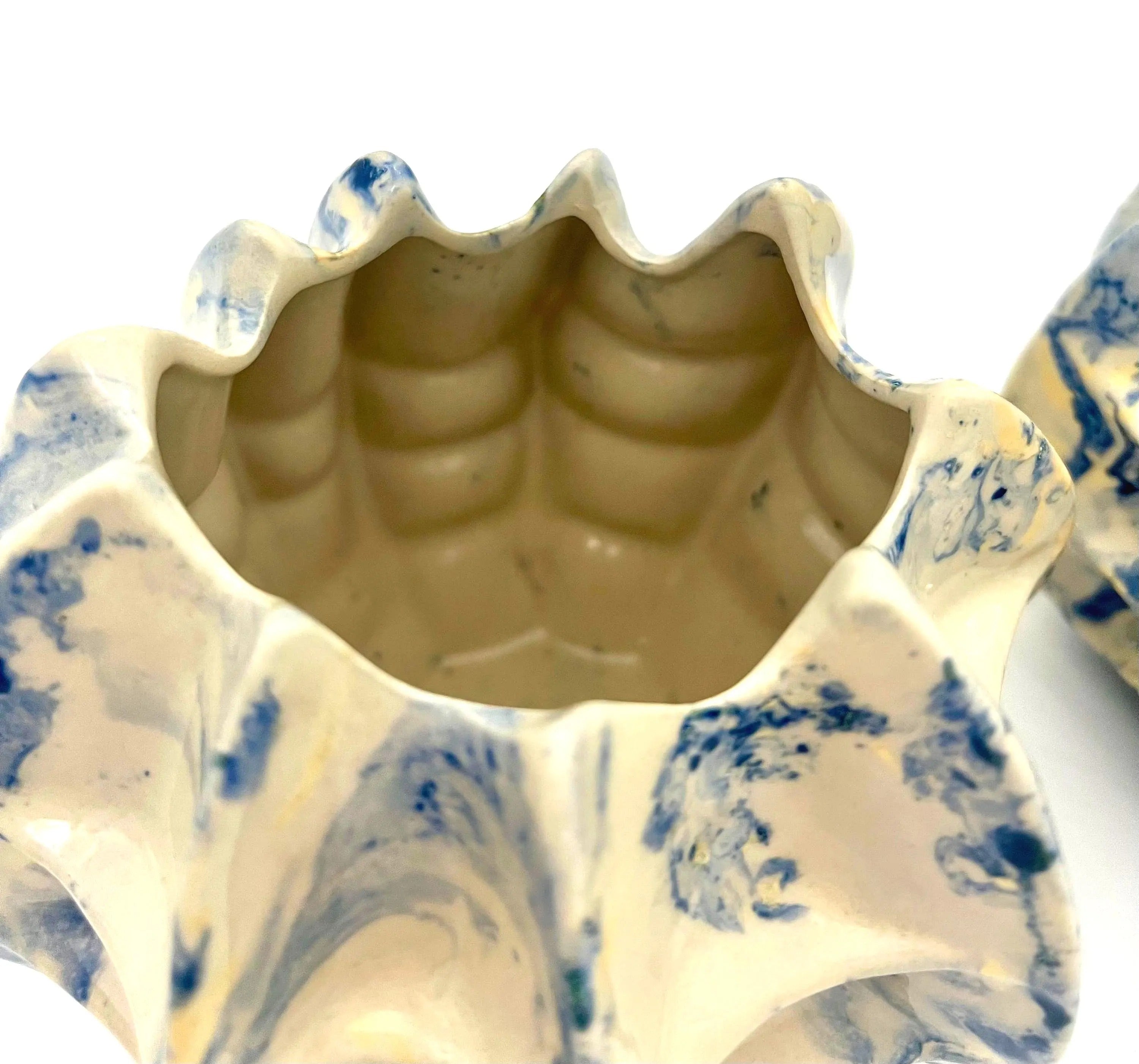 Pair of vintage ceramic planters or candle holders with an abstract blue and white splatter-ware pattern.