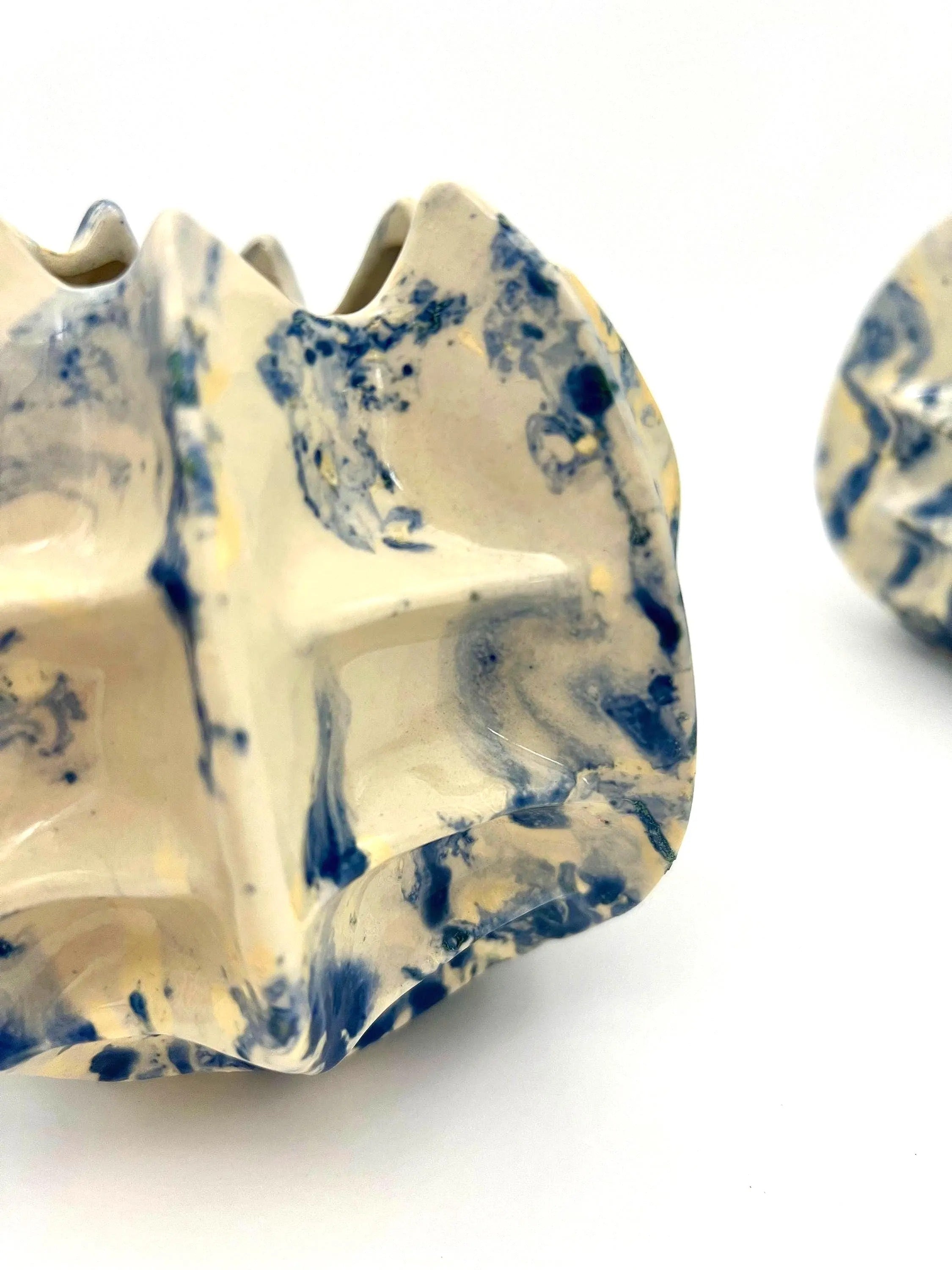 Pair of vintage ceramic planters or candle holders with an abstract blue and white splatter-ware pattern.