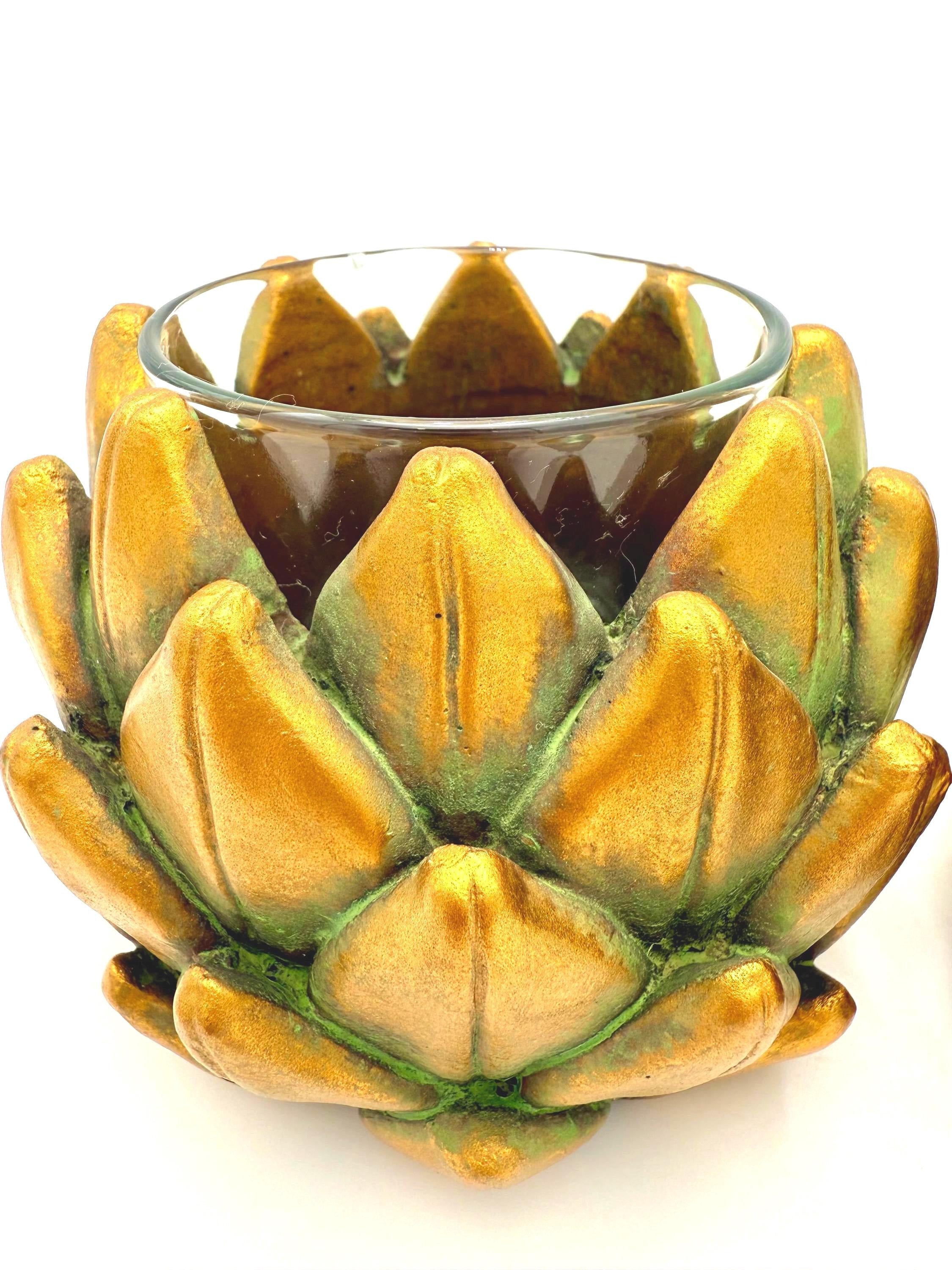 Pair of heavy vintage votive holders shaped like golden artichokes with a metallic finish.