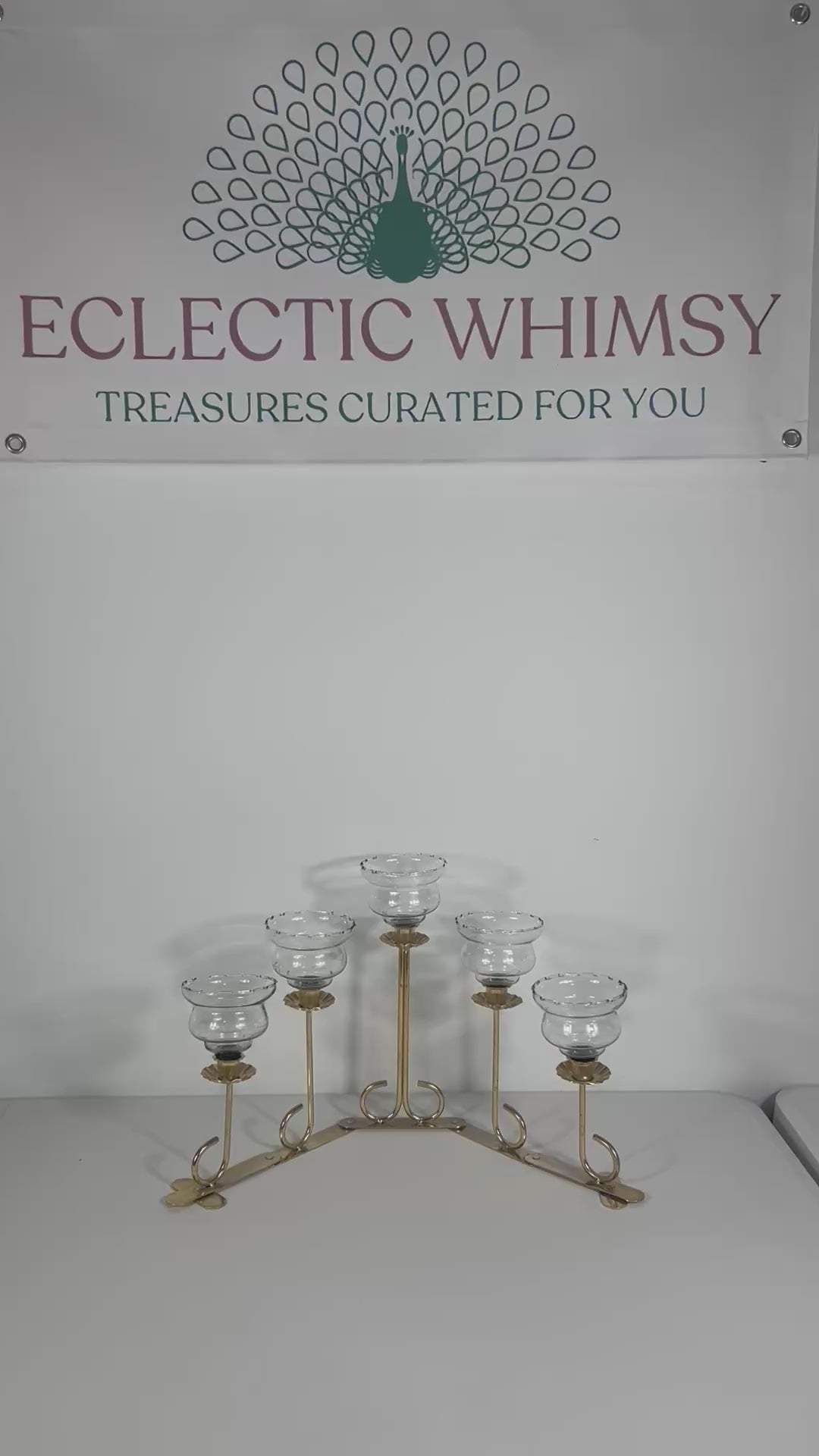 Mid-century solid brass candelabra with adjustable arms for custom candle positioning.