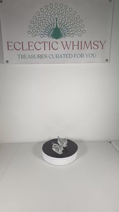 Pair of vintage heavy lead crystal candlestick holders shaped like sitting puppies.