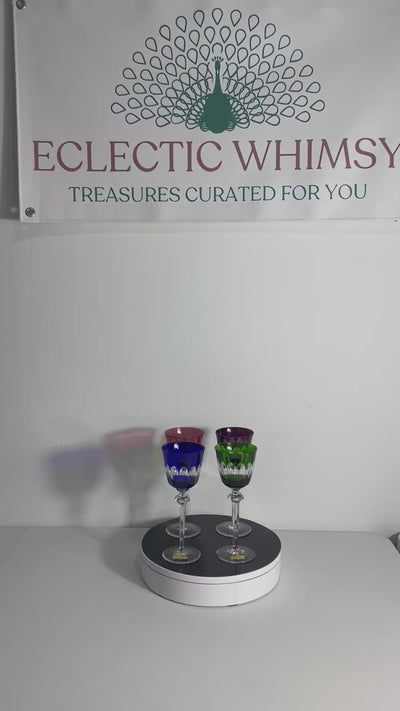 Set of 4 Nachtmann Romer wine glasses in mint condition with colorful cut-to-clear bowls and faceted stems.