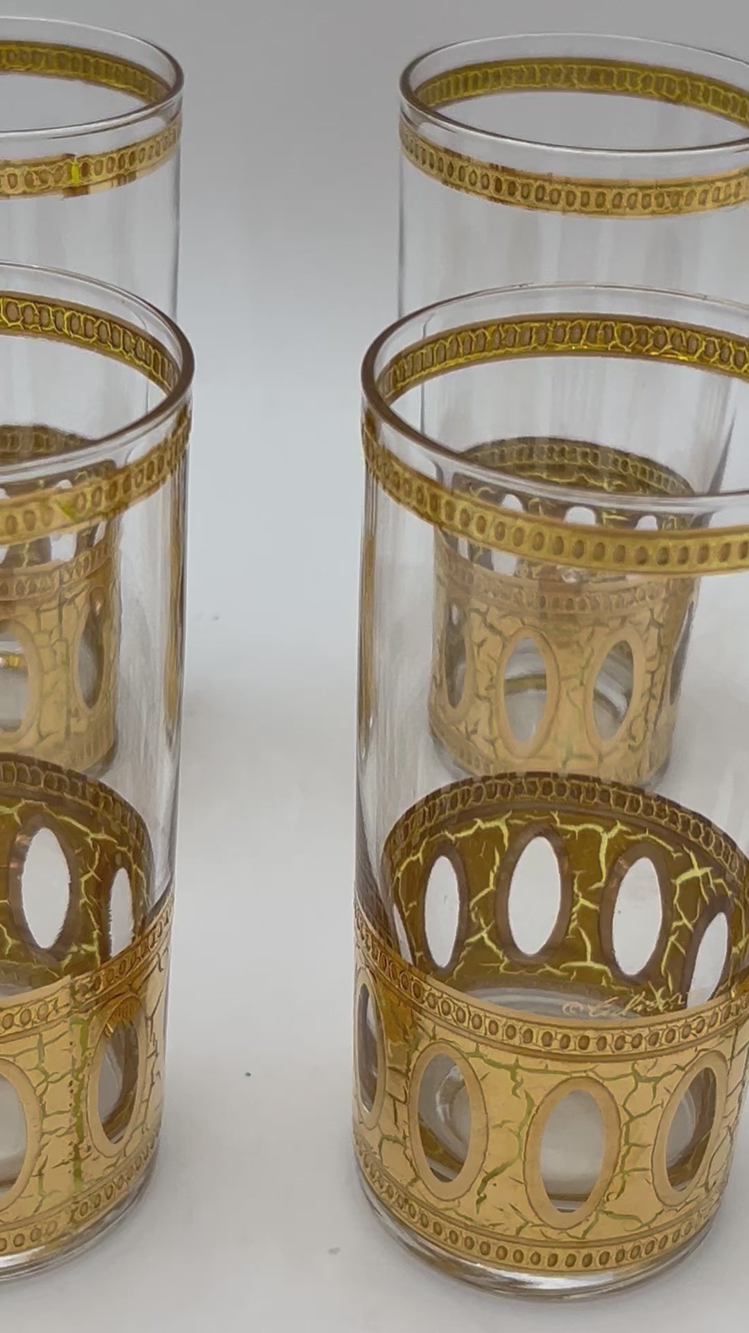 Set of 8 signed vintage Culver highball glasses featuring an intricate 22k gold geometric pattern.
