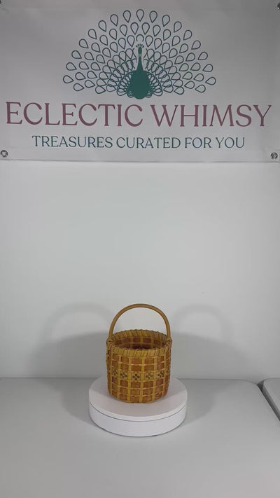 One-of-a-kind vintage artist-signed basket featuring intricate handmade weaving and natural materials.